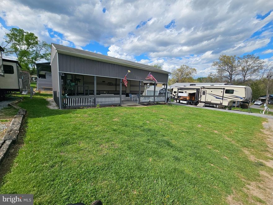 Block 6 Lots 15 & 16 are it! Just the lots you've been waiting for. Immaculate. 
Welcome to Block 5 lots 15 & 16 Poison Oak sitting on a flat double lot in Riverbends Rv Campground. Riverbend is 400 Acres of SEASONAL recreational campground full of amenities located on the Potomac River in Falling Waters, Wv. OPEN APRIL 1 - NOVEMBER 1 - This is a fun & entertaining community, yet relaxing. 
Conveying with these lots are 2 campers one is a 32 Ft 2019 Forrest River Wildwood in excellent condition and a 34 Ft 2014 LARGE Crossroads 5th wheel Sunset Trail with so much space; it will wow you. Also conveying is a 2023 Electric 48 Volt Ezgo Rxv Vallor Golf Cart. 

The Forrest River Camper is housed under a massive pavilion with gutters and downspouts, completely wired with electric outlets and 3 new 54 In ceiling fans that connect to bluetooth to control the speed of the fans and changing light colors via phone. This all sits on a nice est 40 * 20 Ft concrete pad. Inside the camper you'll notice all the upgrades including counters, faucets, and a Mini Split unit to keep you HOT sleepers extra cool. The main bedroom is a Queen size, it has 3 closet spaces and comes with a Dyson vacuum. This bedroom has it's own entry door as well. In the main area, you'll find a sofa that pulls out for extra sleeping, 2 recliners, a Vizio TV, Furrion surround speakers and electric Fireplace. A step outside just sits you on such a spacious beautiful outdoor patio and all the Furniture conveys. Sit, relax and host your friends while enjoying the flat front yard for campfires, corn hole, or even extra parking. The Adjoing lot is paved, while it can fit 4 vehicles in a row it also hosts the very large 5th wheel camper that is perfect for you to have overnight guests. Check out the photos! This camper comes with an outdoor set up with a mini fridge, sink, hook up for a small propane grill. The inside Tv flips around to be enjoyed from the outside. Inside the ceilings are so tall and the Kitchen has more space than you typically see in a camper. The bedroom has its own entry to the bathroom. The 5th wheel also comes with an extra Black water 35 Gallon storage tank Really must see to appreciate. It's a beaut.  The shed has electric and comes with an ice cold fridge, washer and dryer. The roof was sealed in 2025.

Call today for your personal tour. Approx. 10 miles of Deep water on the Potomac River access for boating, fishing & swimming. Yearly membership ($1,987) plus a $200 initiation fee for new owners, includes water, sewer, electric, trash and the park amenities such as 3 pools, putt putt course, Horseshoe club, Boat club, Poker runs, Trick or Treat, Christmas in July, live bands, basketball court, tennis court, fireworks, car show, Church, restaurant, bar, convenience store (Great food), playground, volleyball, ball field and much much more. Join Riverbend Boat Club. Bring your golf carts, water toys and come enjoy life!