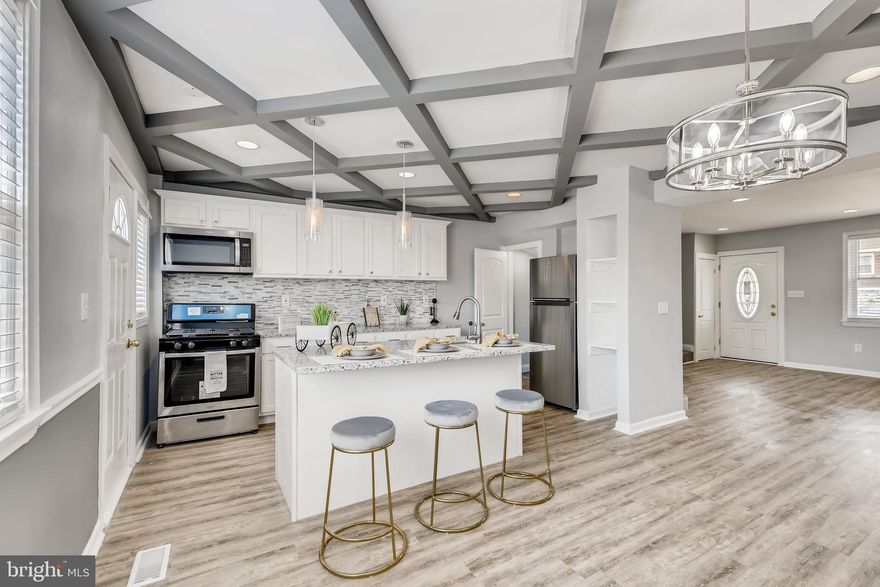 ***Current contract pending release*** Seller has completed ALL home inspection repairs! Appraisal has also been completed! Beautiful fully renovated home ready or its new owner! This home features a gorgeous eye-catching fireplace, coffered ceilings, parking pad, fully finished basement, ceiling fans in each bedroom, deck off of the kitchen with stairs leading to parking pad, beautifully landscaped, large full basement bathroom and laundry area, and so much more! Don't miss the chance to make this home yours today!