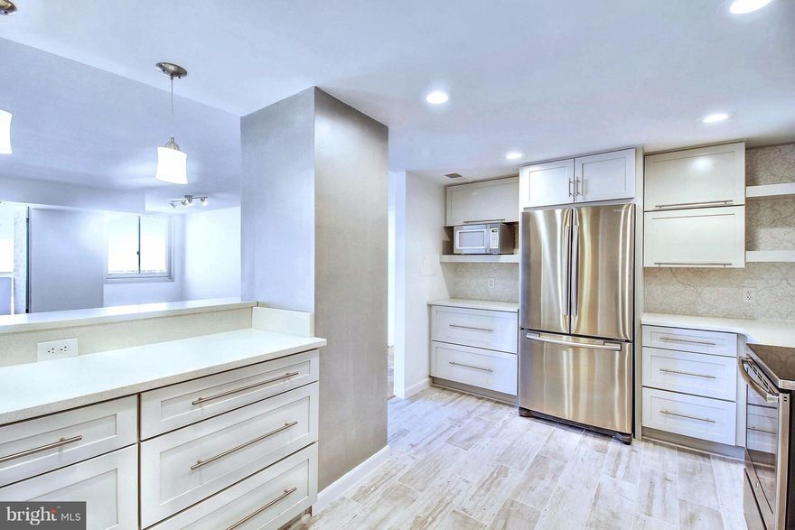 Be the 1st to enjoy the just finished, impeccably renovated chef's kitchen & stunning baths in this elegant & spacious apt with fabulous bedroom views. Sunny/bright corner unit w glass doors to large balcony. Open concept LR/DR is perfect for entertaining. New windows, new W/D in unit, garage parking for 2 cars included. Util included. Pool, gym, 24/7 concierge. Fr. Hts metro, restaurants, shops!