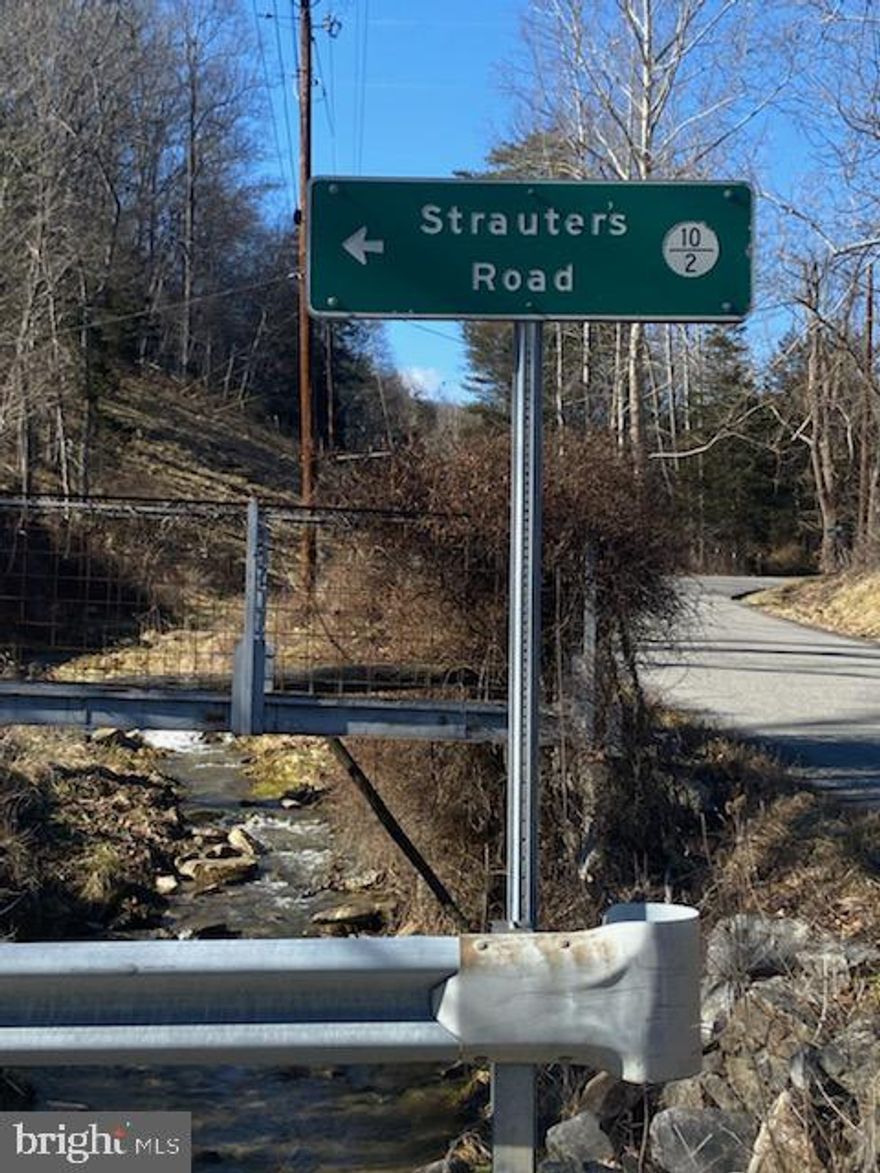 Looking for a place to build? Come take a look at this property! Spring, Septic and Electric. Mostly wooded, excellent hunting.