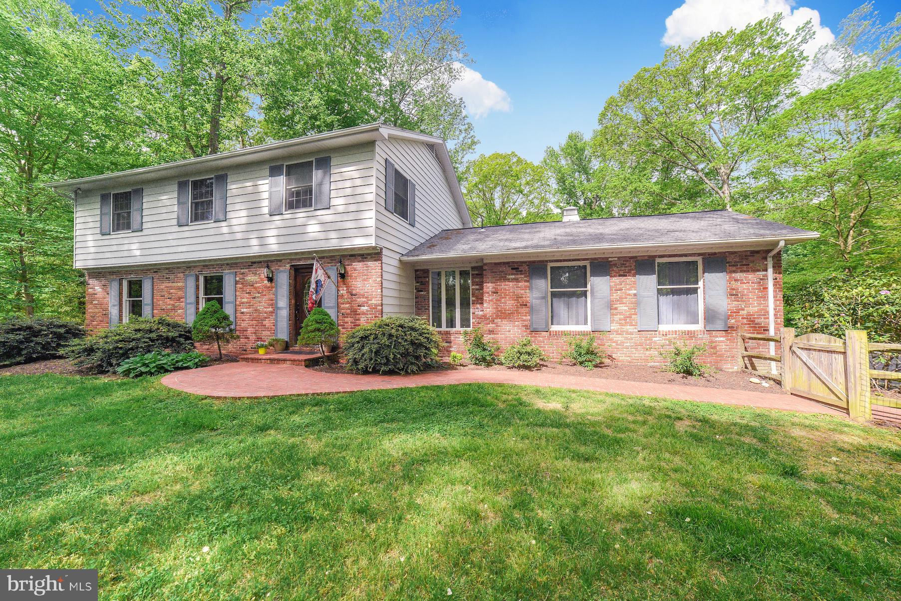 Immaculate Brick Front Colonial nestled nicely on a huge 5 acre lot with a mini farmette in sought after Huntingtown! Featuring 4 bedrooms, 2.5 full baths and 2-car side entry garage. Stunning wood flooring throughout! Entertain in the spacious formal separate living and dining rooms. Large eat-in kitchen table space with side by side refrigerator, wall oven and lots of cabinet and counter space. Relax in the open and airy sun room with skylights and lots of windows and for natural lighting. Spacious family room with a cozy wood burning brick fireplace. Master bedroom with great closet space, gorgeous updated master bath and gleaming wood floors. Master bath with tile and two separate vanities with storage and beautiful counter tops! Additional bedrooms with gorgeous flooring and ample closet space. Laundry & mud room off from the garage with storage closets and full size washer & dryer. Basement with walk-out level and LOTS of space for rooms and storage. Entertain family and friends on the 2-tier deck overlooking the nicely landscaped back yard! Massive backyard barn w/stalls is perfect for a workshop, animals or make into your own! This gorgeous home features multiple pasture areas, fenced yard, water filtration system, water softener and more! Waiting just for you!