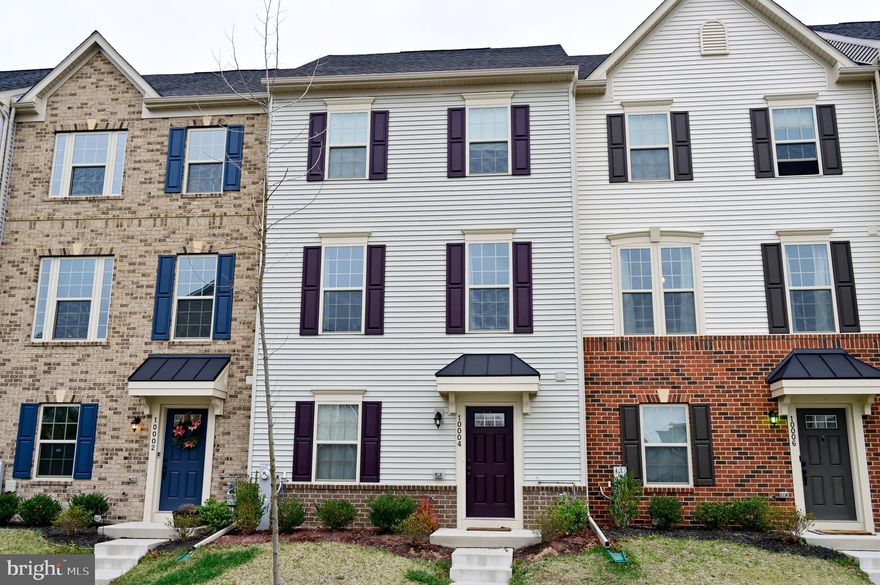 This is a beautiful and spacious home with almost 1800 sf of usable space. You enter the first level and have a room that can be used as a bedroom, study or recreation area with a full bath and a two car garage with access directly to the home from the garage. Access to the garage is via an alley way that allows for additional parking if necessary. Parking can also be on the street in front of the home. The community is only 3 years new and is in an exciting and growing area of Middle River. It is quite close to stores, and restaurants and has its own pool and club house. On the second level you have an open floor plan with your living area to your left, a spacious island that can accommodate at least 4 or more chairs and a dining area which leads to the deck which over hangs the garage. There is a half bath on this level and floor in kitchen is hardwood with neutral color carpet in living area. On the third and finally level you will find 3 spacious bedrooms with a master bathroom and also a hall bath. It is convenient to public transportation and just a hop, skip and a jump to Martins. And down the street you have one of the few remaining Drive In Theaters isfyou want a night of nostalgia.