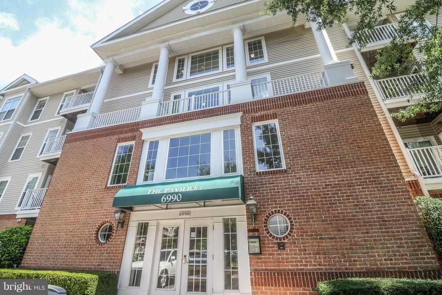 Walk to Metro * Garage parking * Freshly painted 2 Br 2 Ba condo located on the main level * Hardwood floors * New neutral carpet * Living room w gas fpl * Sep dining room * Kitchen w new granite, new stainless sink, new disposal and new stainless appliances * Generous sized bedrooms * Large laundry/storage area * Balcony * Storage unit * Walk to shopping * Community pool