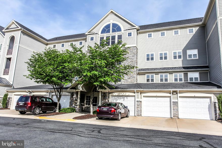 Luxury condo with sun room/dining room. Master suite with 2 closets & beautiful bathroom. Kit w granite counters, SS appliances & back splash. Home theater system w HD projector & 91 inch electric screen. Clubhouse w pool/ gym/gated/secured. One of the few with garage and large storage room. VRE in community, 4 mi from 95, 9 mi to Quantico, 10 mi to Belvoir.