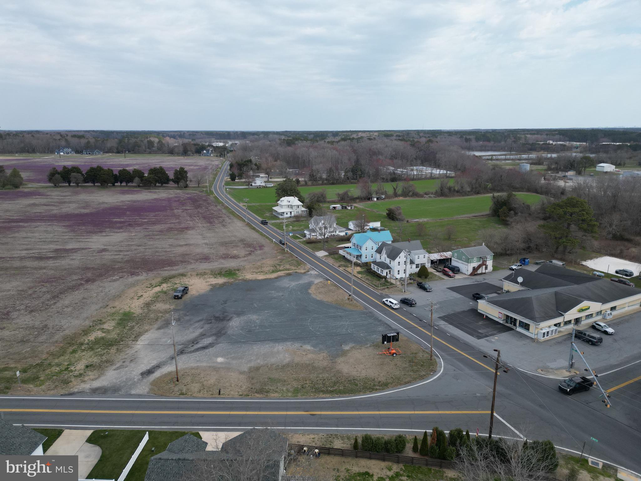 Endless possibilities, Commercial lot. 1 acre with a short walking distance to downtown Berlin. Sale to include 4 Edus. Many uses for this vacant parcel. Tremendous exposure on Main Street going into downtown Berlin