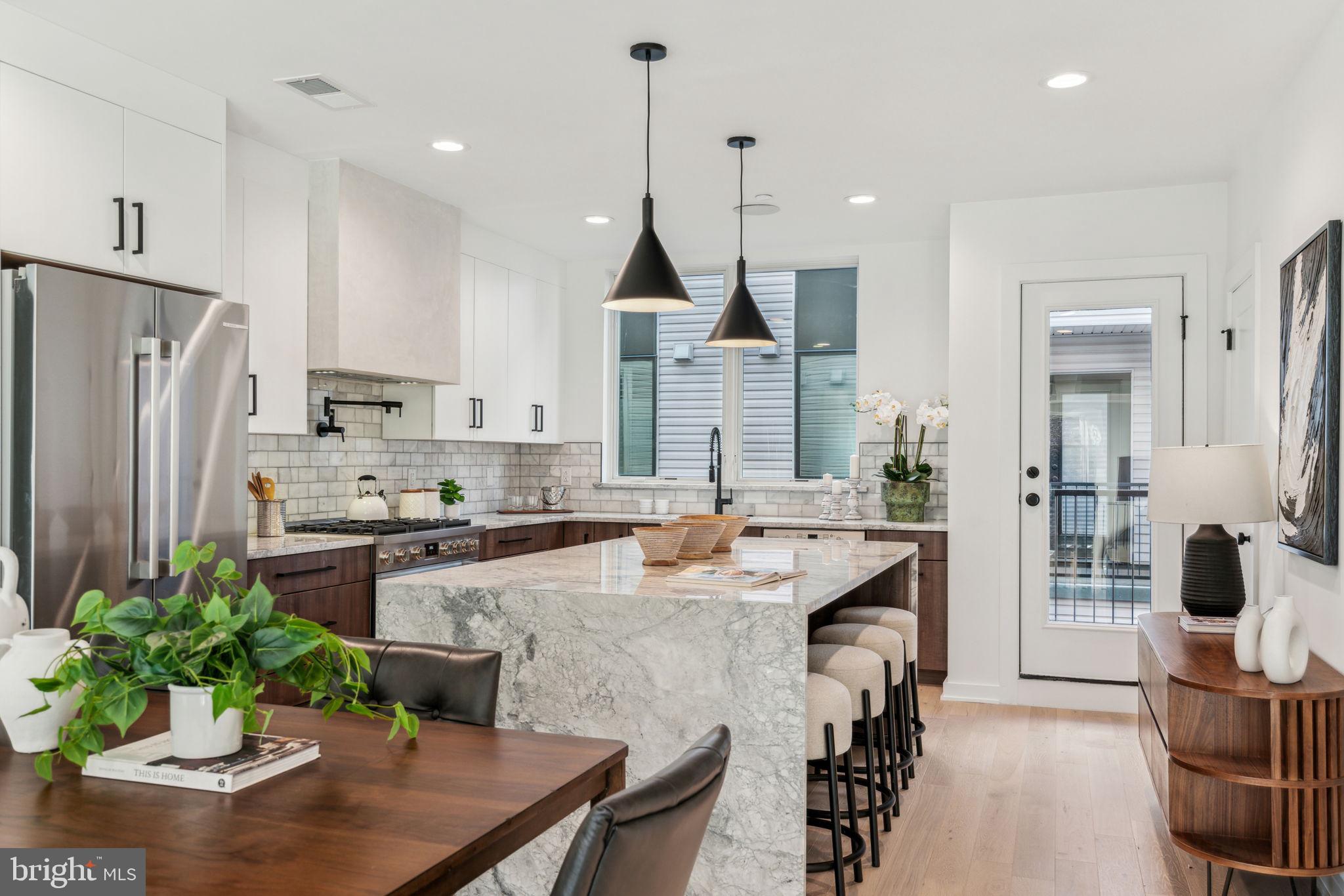 Welcome to Wendle Place Phase 4—a rare opportunity to design your dream home in one of Philadelphia’s most sought-after new construction communities. For a limited time, buyers will have the ability to personalize select interior finishes, including cabinetry, tile, flooring, lighting, and bathroom fixtures. Customize your home to match your taste, all while enjoying the confidence of working with an experienced development team and curated materials that maintain design integrity.
Phase 4 residences offer the same premium layout as prior Phases 1 & 2, with a dramatic split level living area with soaring ceiling heights, 3 bedrooms, 3 full baths, 2 half baths, a 2 car garage parking, multiple outdoor spaces, and a private rooftop deck with green roof. Every home includes the full 10-Year Tax Abatement and a 1-Year Builder’s Warranty.
Nestled along the beautifully tree-lined 6th Street in the heart of Northern Liberties, Wendle Place is in a prime location just steps from some of the neighborhood’s most iconic destinations—Bardot Café, Café La Maude, and Liberties Walk—offering unmatched access to dining, shopping, bike trails, and public transit. Developed by Catalyst City Development and designed by Gnome Architects, the project seamlessly blends modern design with timeless craftsmanship.
Phase 4 homes are estimated for delivery in Spring 2026. Custom selections must be finalized by December 2025 to meet the build timeline. Don’t miss the chance to create something uniquely yours at Wendle Place. **Taxes are not $0, however, homes do come with an approved 10 Year Tax Abatement.* Ask about our financing options with preferred lender.*