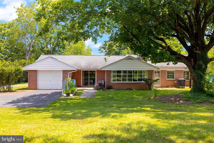 Welcome to 312 N. Louisiana Ave—a beautifully renovated brick rancher situated on a spacious half-acre corner lot with no HOA and direct access to Martinsburg’s beloved War Memorial Park. This 3-bedroom, 2-bath home offers over $70,000 in upgrades, including a brand-new roof with gutters and downspouts that comes with a transferable warranty on workmanship and materials, fully renovated bathrooms with new vanities, tile, plumbing, and heated floors in the primary, a refreshed kitchen with quartz countertops, new appliances, new flooring, and updated plumbing and electrical, plus a new hot water heater. The living room is filled with natural light from a wall-to-wall window and highlights the original hardwood floors and cozy fireplace. An updated laundry room with new washer and dryer adds convenience, while an attached and detached garage provide ample storage. With park amenities at your doorstep—trails, pools, tennis courts, playgrounds, and open green space—and just minutes to I-81, MARC/Amtrak, downtown Martinsburg, shopping, dining, and WVU Medical Center, this move-in ready home blends timeless character with modern comfort in a location that can’t be beat.