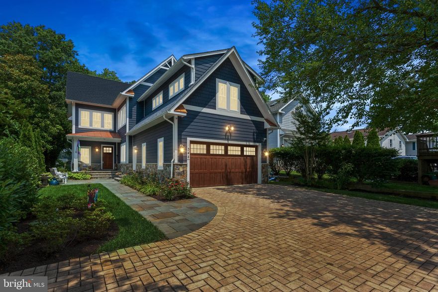 This stunning custom craftsman style home (built in 2018) situated on 3/4 of an acre of waterfront located on the Magothy River features 6 bedrooms, 4 baths, 3 fully finished levels and many, many upgrades including casement windows throughout the entire home, a whole house generator and security system.  The main level offers unbelievable water views with floor-to-ceiling windows, walnut hardwood floors, coffered ceilings and a bedroom with a full bath. The gourmet kitchen opens to the family room and boasts stainless steel appliances, gorgeous quartz countertops, gas stove and stacked stone fireplace with built-in cabinets.  Upstairs has 4 spacious bedrooms with 2 full bathrooms and a huge laundry room on this level.  The Primary bedroom has a vaulted ceiling, his & her walk-in closets, and master bathroom with an elegant standalone tub and large separate shower with upgraded shower heads. A lovely private porch is accessed from the master bedroom allowing you to enjoy your morning coffee while soaking in the fantastic water views. The finished basement has 1 bedroom with a full bath, home theater and game area.  The backyard makes this home complete with Ipe decking spanning the width of the home and an outdoor kitchen. The deep water pier with 12’ depth has a 25,000 lb. capacity boat lift and two additional jet ski lifts and docking for 2 additional vessels.  There is a newly renovated guest cottage located on the property which is perfect for the in-laws or rental.  The cottage has 2 bedrooms, 1 bath, living area, kitchen and its own laundry room. Blue ribbon schools a plus!