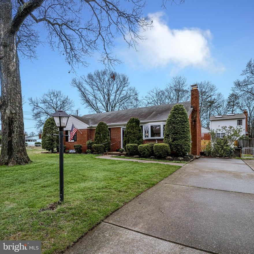 Welcome Home!! This immaculately maintained 3 bed/2 bath home features over 2000 sq ft of freshly painted, fabulous living space! The charming main level boasts gleaming, newly refinished, hardwood floors, a wood burning fireplace, 3 ample-sized bedrooms and a full bath. The walk-up lower-level mirrors the entire footprint of the upper level, making way for a huge recreation space, bonus room, laundry and storage area! Situated on a sprawling .35 acre corner lot, this spectacular property has a fully fenced rear and side yard,  neat landscaping and large patio for outdoor entertaining.  Convenient commuting options, including easy interstate access and close proximity to the metro, make this home a MUST SEE!!