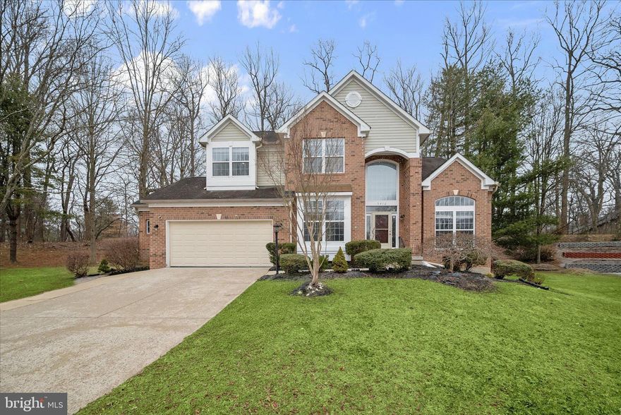 Welcome to 5412 Bucksaw Court, nestled on a quiet cul-de-sac in the desirable Trails of Woodlot community. This impressive home showcases a handsome exterior with a brick portico, lush, landscaped grounds, soaring ceilings, classic moldings, and a timeless neutral color palette throughout. A welcoming two-story foyer sets the tone, leading to a light-filled living room with palladium windows and a gracious dining room perfect for entertaining family and friends. The eat-in kitchen is thoughtfully appointed with granite countertops, decorative backsplash, soft-close cabinetry, a center island, and a walk-in pantry/laundry room, and flows seamlessly into the breakfast room with direct access to the expansive tiered deck ideal for indoor-outdoor living. The family room is anchored by a cozy fireplace and offers serene backyard views. A private office, powder room, and convenient garage access complete the main level.
Upstairs, retreat to the spacious primary suite featuring vaulted ceilings, a sitting room, an en-suite bath with dual vanities, soaking tub, glass-enclosed shower, and a walk-in closet. Three additional bedrooms and a full bath provide ample space for family or guests. The finished lower level offers a recreation room, bonus room, full bath, and a versatile area to suit your needs. An expansive deck and attached two-car garage complete this exceptional offering.
Some photos have been virtually staged