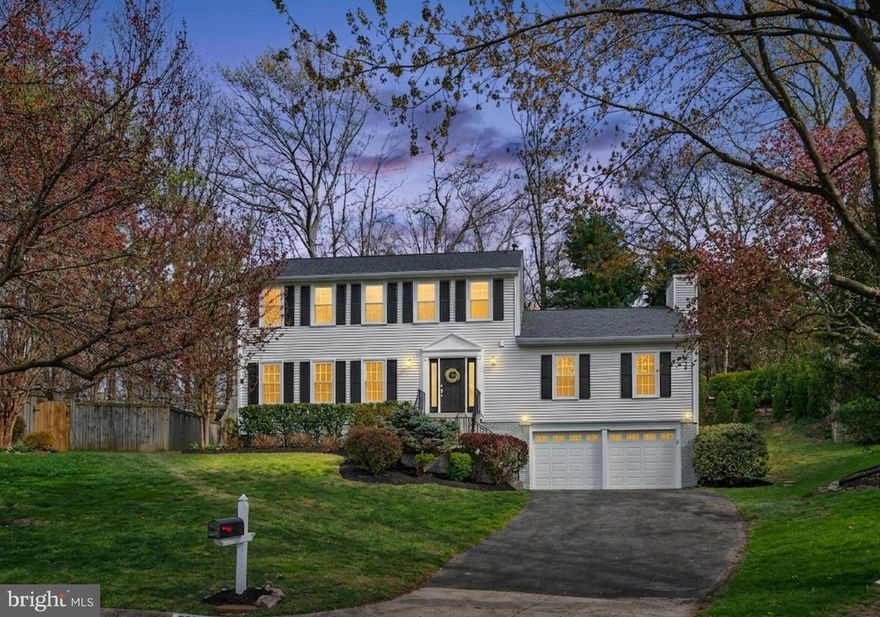 Impressive Colonial featuring 5 bedrooms & 3.5 baths in an idyllic setting with an incredibly private backyard & situated at the end of a quiet Cul-D-Sac. Where tranquility meets convenience within the sought after Afton Glen neighborhood comprised of 142 homes nestled next to Middle Run Valley Stream Park & endless commuter options. Bonus: There are  2 tot/lot playgrounds within walking distance & it is within the top tier Sangster elementary & Lake Braddock secondary school districts...this private haven has everything you have been waiting for! The only home in this neighborhood that offers an enormous (27x20) family room featuring a gas fireplace with stone surround & hearth, gorgeous hardwood flooring, 2 skylights & ceiling fans, big picture window & french doors open to multi-level deck!  The gourmet kitchen is the heart of the home, completely remodeled & featuring a breakfast bar island, exotic granite counters, custom backsplash, under cabinet lighting & flows into a bright & sunny breakfast room with big bay window with scenic views of the backyard & nature all around. Welcoming, entryway with gorgeous hardwood flooring, contemporary lighting, custom molding, deep coat closet, beautifully remodeled half bath & new front door with atrium windows let in lots of natural sunlight. Generous formal living & dining room with new chandelier, crown molding, freshly painted & warm hardwood flooring. Make your way to the bedroom level with hardwood floors on stairs, landing/hallway, newer carpet in all upper level bedrooms! Expansive primary bedroom suite has room for a sitting area, incredible private bathroom with skylight & 2 comfort height recessed panel vanities with quartz counters, stunning, custom tile shower & flooring. Huge walk-in closet with Elfa organizational system, easy to adjust shelving to your needs. All 3 additional bedrooms offer plush carpeting, ample closet space, contemporary ceiling fans/overhead lighting & share a fantastic, completely remodeled hall bathroom with skylight, deep tub, custom tile in shower, comfort height, recessed panel vanity with granite top & modern lighting. Fully finished lower level featuring: neutral, ceramic tile flooring in hallways, cubby space for extra refrigerator & finished laundry area with white cabinets, sink & next to big walk-in closet storage area with lots of shelving. Fantastic media/recreation room with plush berber carpeting, dramatic columns & storage closets. Giant 5th bedroom with double closets & private bath that has been completely remodeled with floor to ceiling ceramic tile in shower, comfort height vanity, glass inlay display shelving & so much more! European style egress window in basement adds a more finished look & extra natural light. Lots of extra storage & a finished laundry area with front loading washer/dryers. Don't miss the incredible oversized garage with lots of additional storage behind 2 cars (great exercise area or bike/motorcycle storage). Long asphalt driveway offers additional car parking in your own driveway instead of on the street. Roof with 50 year architectural shingles in 2022, Newer: HVAC system, windows, skylights & french door. Fabulous location provides shopping, restaurants, Franconia/Springfield Metro Station & VRE train stations within 5-6 miles & an easy commute to Fort Belvoir, Pentagon, NGA building on Backlick Rd, commuter parking lots are just a few minutes away & other commuting routes (Fairfax County & I-95) makes this an ideal, centrally located neighborhood. Surrounded by scenic parks like Middle Run Stream Valley park & Lake Mercer with jogging/walking trails that lead you past South Run Rec Center to Burke Lake Park with marina & golf course/driving range.