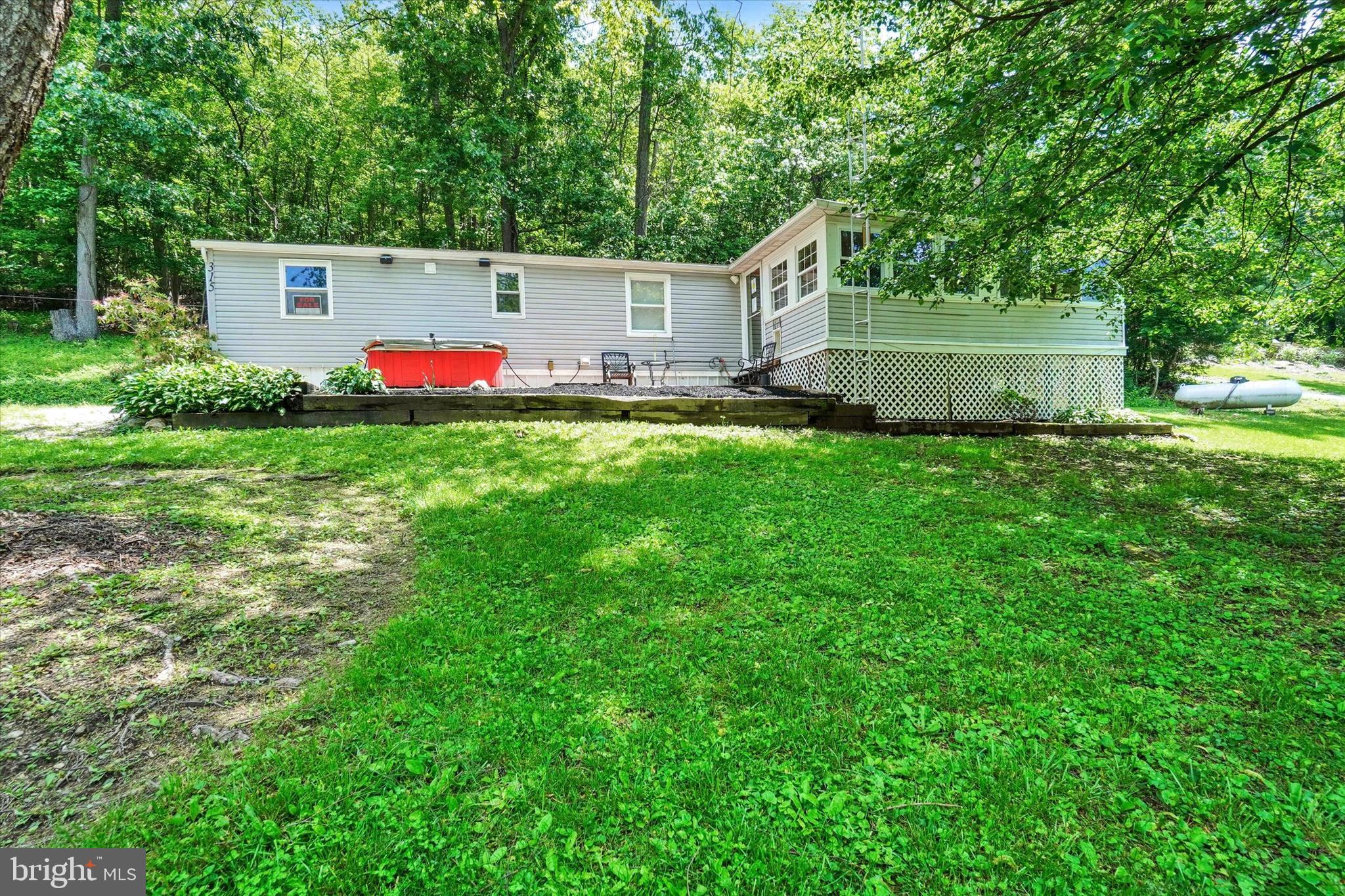 Thanks for taking the time to check out 315 Husson Rd. This 1984 mobile home sits beautifully on this lot. Is country at its best where you are surrounded by birds, animals,trees etcetera. House does need a little bit of cosmetic updates but is priced accordingly. Home has an eat in kitchen, living room, and an addition off the front of the house. Large storage shed and plenty of parking. This home is located appoximastely 8 minutes from the square in Red Lion... so you have country amenities yet close to civilization.