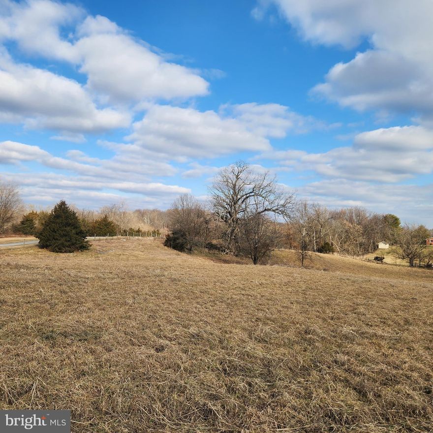 Scenic 5.10 acre with a mix of mostly open and woods. Upper parcel is cleared and ready to build with astounding views all around.  Conventional perc approved through Washington County.  Approximately 80% of the parcel features recently installed fenced.  A few unique features of the property are a 300 year old grandiose oak tree, pole building/machine shed, remaining silo and removed barn foundation. 6 Miles to I-70 as well as MVA, breweries, restaurants and shopping!