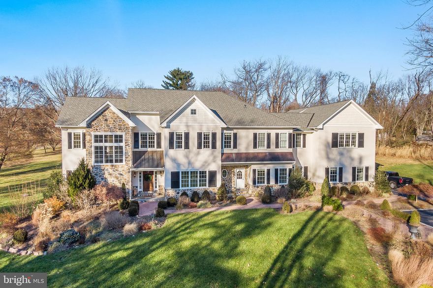 Welcome home! This luxury property backs up to a picturesque horse farm and is walkable to an 88 acre preserve with a pond and walking trails.  Built in 2006, this home is meticulously maintained and offers stunning custom millwork, wainscoting and moldings and beautiful hardwood flooring.
Enter the front door and be amazed by the grand foyer with a side sweeping staircase to the second floor.  Just beyond find double doors to a first floor office/library and a reception hallway with a coat closet & formal powder room.  The living room and dining room are open to the foyer with gorgeous picturesque views.  The living room offers a wall of windows, recessed lighting, sconces and access to the great room. The formal dining room is expansive and perfect for large or small dinner parties with more scones, custom millwork and an adjoining butler pantry with wine fridge and cabinetry.  The gourmet kitchen is the heart of this home and features custom Goebel cabinetry, a large island with farmhouse sink, all stainless steel appliances, top-of-the-line range/cooktop, double oven & built-in refrigerator.  Additionally, find two dishwashers, two sinks and all upgraded marble surround on counter tops, backsplash and fireplace surround.  A sunny breakfast room with windows and doors overlooking the expansive stone/concrete patio and pool & spa completed in 2019.  The pool features a raised stone heated spa with jets and three waterfalls that cascade into the pool below.  There are 6 water fountains, three on each side that shoot over the heated pool.   Other pool features include a remote control with the ability to change pool light color from blue, green, pink or purple and turn spac and fountains on all from inside the home.The Great room features a marble surround gas fireplace with custom built-ins and gorgeous french doors and windows overlooking the lush lawn, pool & lush landscaping.   From the kitchen area is a second staircase upstairs and a large mudroom with custom cubbies and an attached oversized three car garage.   Walk-up the main staircase to a landing with a large palladium window overlooking the front yard.  The hallway is expansive and opens to another more casual family room.  There are three large full bedrooms each with custom ensuite baths, walk-in closets and a full laundry room with cabinetry, sink and more.    The primary bedroom suite is located at the end of hallway near the second rear staircase and features a luxury bathroom suite with separate tub & shower, a full walk-in closet with cabinetry, draws and more.  The main bedroom features a vaulted ceiling with space for a sitting area and french doors to another room which could be an exercise suite along with a separate staircase to a finished loft area for sewing, wrapping presents or holding storage.  The third floor is finished with a 5th bedroom, full bath and playroom area with custom moldings, built-in benches, storage and more.  The lower level is full and offers high ceilings with walk-out sliding doors & windows to the side yard.  This partially finished and completely open space offers a great indoor gaming and sporting area to play with newer plank flooring all completed in 2020.  The lower level has a bathroom roughed in and ready to complete if desired.   This luxury property meets today’s evolving lifestyle standards.  The exterior offers custom landscaping designed by Maria Brooks and maintained by Pezzotti Brothers. The exterior was professionally painted in 2020 with new shutters added with colors designed by Barbara Balongue known for the interior design of White Dog, Autograph and Rosalie Restaurants.  The home is conveniently located in the highly ranked T/E Schools & near all major commuting routes. Incredible move-in condition & quality!