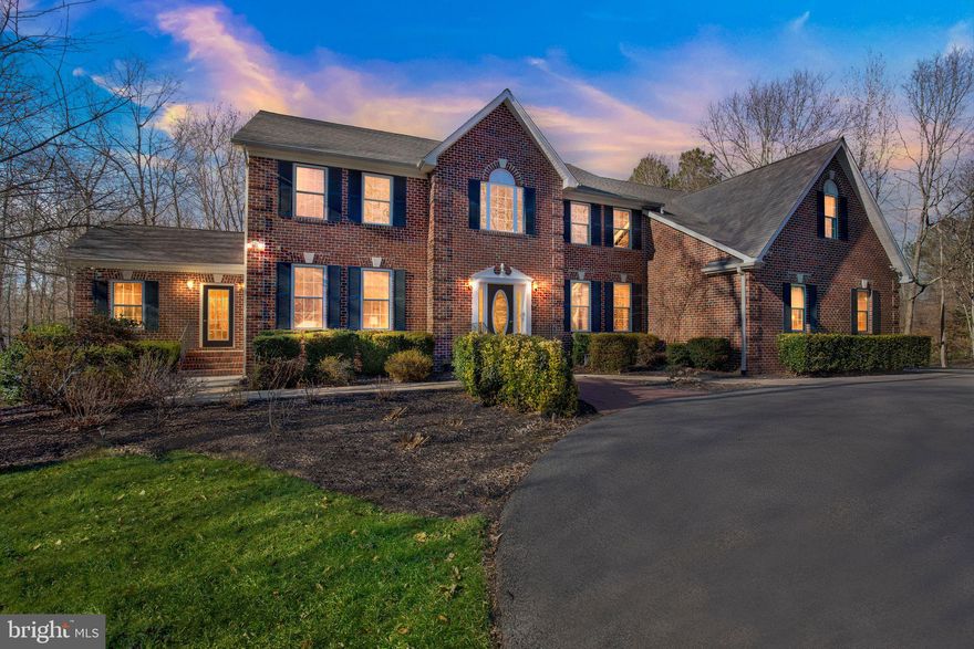 Move right in.....this home is a showstopper....better than new! Tucked away on 3.59 acres, everything has been upgraded. Main level offers stunning hardwood flooring throughout, great room with 2 story ceilings and walls of windows letting nature and light in. Formal living room with custom, built-in bar and formal dining make this an exceptional home for entertaining and large gatherings.  Kitchen for the gourmet cook offers natural quartzite stone counters, butlers pantry, coffee bar, beverage fridge, stainless appliances and top of the line Viking range. The beautiful sunroom at the far end of the home is perfect for an in-home office or to curl up with a good book. Fully finished, walk-out basement is a whole new world! Work-out room, wet bar/kitchen, media room, pool table, 2 large storage rooms, full bath and you can even stroll out to enjoy a dip in the hot tub. The private master suite on the upper level offers a built-in vanity area, custom bath w/ natural quartzite stone counters and built-in his & hers closets. Enjoy the amenities of the Avenmar Community; pool, dock and kayak storage, tennis courts, tot lot and club house.