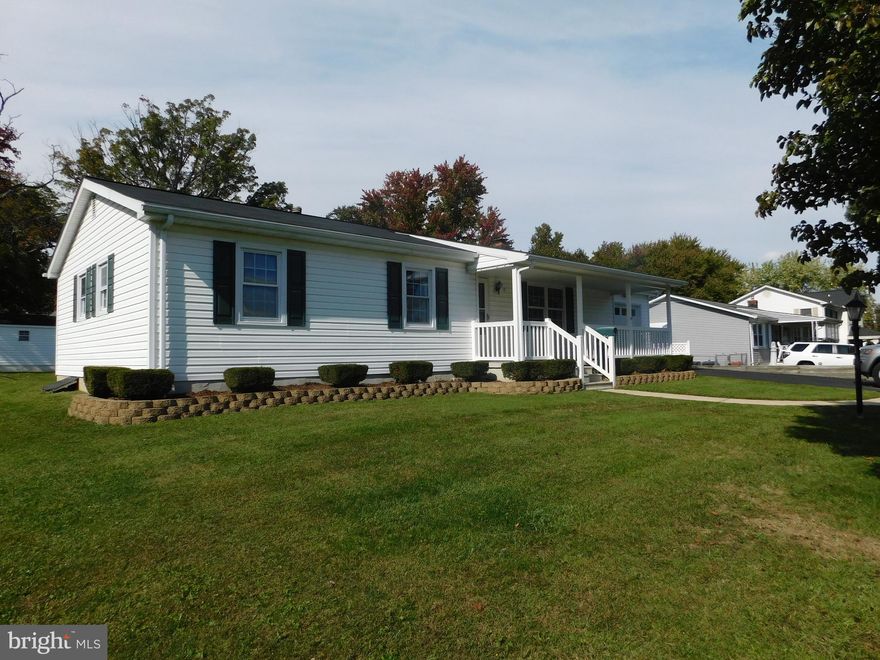 A comfy home in Essex community.  Well-maintained with fresh interior paint and hardwood floors throughout.   The main level living area is increased by the enclosed rear sunroom and open patio which overlook the level rear yard with detached 2-car garage/shop and storage shed. You will enjoy the basement family room with wood stove and 1/2 bath plus a spacious workshop/laundry area.  Detailed description of the dual paved driveways and paved parking area are in the MLS documents.  Vacant and ready to show and sell, today!