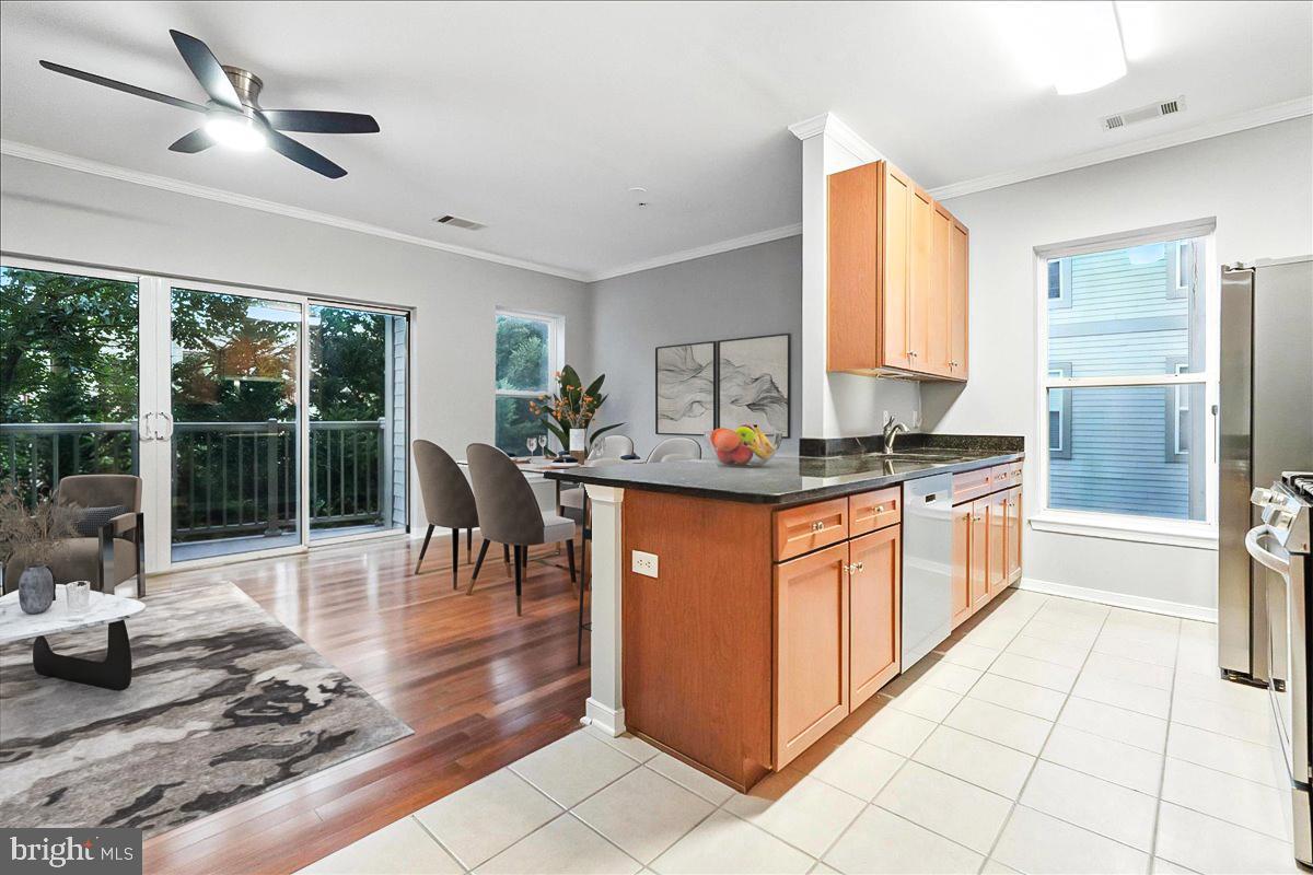 Priced To Sell Fast! Highly Sought After Updated 3rd Floor Condo, Spacious Kitchen with GRANITE Counters, Stainless Steel Appliances, Spacious Bedrooms, Updated Bathrooms, Hardwood and Tile Floors, New Custom Paint, Walk in Closets, Washer and Dryer in Unit, Balcony, 1 Assigned Parking Space # 28, Water Included in COA Fee, Much More!! Close to Schools, Shopping, Metro, and Commuter Routes. This Will Not Last!