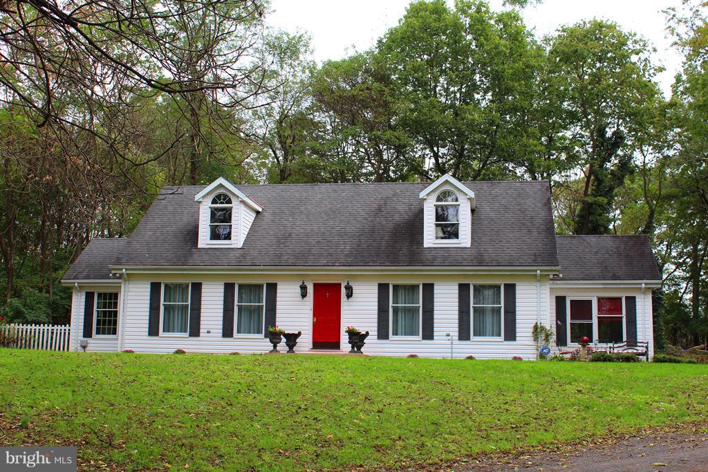 Privacy and peace, this home sits on a mostly wooded 2 acre lot in the sought after Arden area of Berkeley Co, minutes to I 81, 3 bedroom with the master on the main level, 2 .5 baths move-in condition rear garage for all you hobbies, side carport, covered rear deck, formal dining, eat-in kitchen, fenced yard!