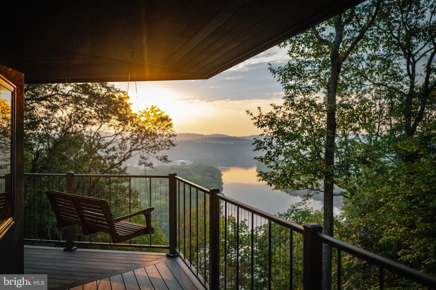 Rich in texture and filled with subtleties of design throughout, this impeccably maintained Bucks County home is nestled amongst an extraordinary setting with stunning views of the sweeping Delaware River. Privacy and tranquility are assured by a long gated drive and the surrounding 60 acres of woodland, river frontage and spectacular long distance views. On these expansive and diverse acres you could spend days exploring your own secluded woodlands, winding trails, and rocky waterfalls, where the rush of clear waters tumbling down forest brooks after spring rains is a sensory feast of sight and sound.

Defined by exquisite detailing and an artist’s eye to frame the endless blue skies and breathtaking river views, the home is perched on the geographically notable Palisades of Bucks County.  Timeless materials lead from the foyer with granite floors and a natural stone feature wall, a tribute to the rocky cliffs the home is anchored on, to the glass-walled great room, sitting area, and kitchen. Every room is oriented towards the view with a flourish of angles and walls of windows. Here, privacy is so complete window treatments are unneeded. Red oak and ceramic tile floors and vaulted ceilings flow past the massive floor-to-ceiling stone fireplace in the great room into the kitchen where granite counters, tumbled backsplash, and island with seating for 5 will satisfy gourmet cooks and everyday family living. A massive wraparound deck feels more like an outdoor living room with Trex decking and vaulted wood ceilings. Lounge in your hammock, “work” from home, or host gatherings rain or shine with bald eagles and herons as guests of honor as they glide over the river at your eye level.  

Located just past a handsomely appointed office with built-in bookshelves and desk, the main floor primary suite is housed in its own wing, allowing you to begin your day with a mesmerizing sunrise touched off by the sparkling river. The room is floored with red oak, capped by a vaulted ceiling lit by skylights, and features a built in bed made of gleaming Brazilian hardwood. An ensuite luxury bath is rich in high-end finishes and amenities including a Jacuzzi tub and frameless glass shower with double shower heads and a window that opens to catch the river breeze. An adjacent dressing room offers finely crafted built-ins and dual walk-in closets. 

The expansive walk-out lower level also enjoys walls of windows and access to a covered wrap around deck and outdoor shower. A family room with stone fireplace, recreation room, and den with built-in wet bar and beverage cooler are flanked by two bedroom suites with walk-in closets and accommodating baths.  

Comfort, convenience and efficiency are ensured by a premium geothermal heating system replaced in 2023 and 2024. The home is dressed in a cedar shake roof, stained cedar siding, and 2025 skylights. In addition to the attached 2-car garage, a detached barn offers a 3-car garage with vaulted ceiling and oversized bay doors. An adjacent workshop will accommodate hobbies, projects, and parking for recreational vehicles.  

This amazing 60 acre oasis is already subdivided and offers possibilities for a family compound.  While the main attraction remains the incredible panoramic views, when you need to be grounded you’ll appreciate the fact that the quaint and historic riverside village of Frenchtown is 15 minutes away and Doylestown is a 30 minute drive through the bucolic countryside. New Jersey is visible across the river, and Manhattan is just 90 minutes. This home sits in sparkling condition ready to welcome an owner who values privacy, quality craftsmanship, and the beauty of nature.