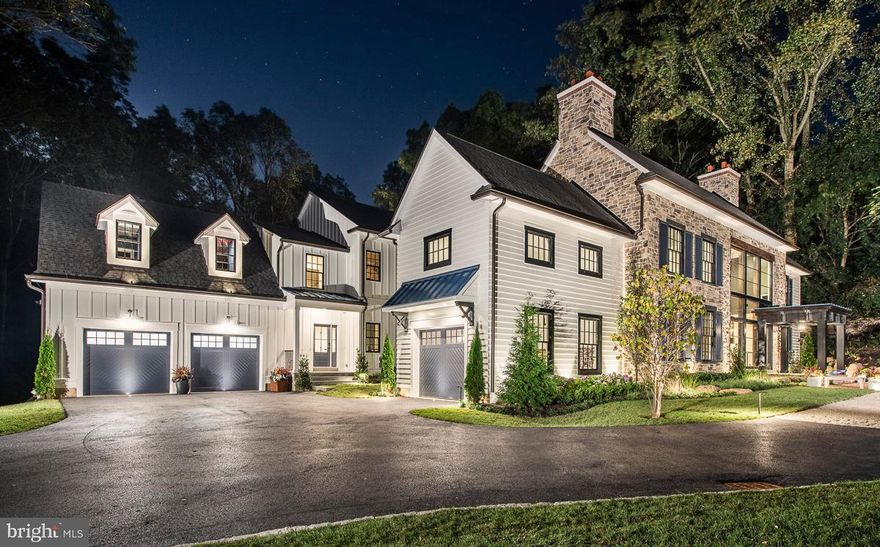 Stunning Modern architectural styling with a dynamic floor plan on a 2.9 acre homesite in Villanova PA built by Mark Weiss. Featured as this year's Philadelphia Magazine's 2019 Design Home. Salvaged materials such as reclaimed wood beams are used to accent a neutral palette. A creative blend of textures including stone, wood, and metal diffuse and reflect daylight through full walls of glass. Statement lighting continues to make the home glow once the sun goes down and adds to the overall feeling of comfort and warmth. Striking details catch your attention as you enter each new space. A floating staircase greets you inside the impressive three-story foyer that offers views from the front of the home straight through to the outdoor terrace. Three generous fireplaces warm the first floor spaces and invite people to gather and stay for a while.