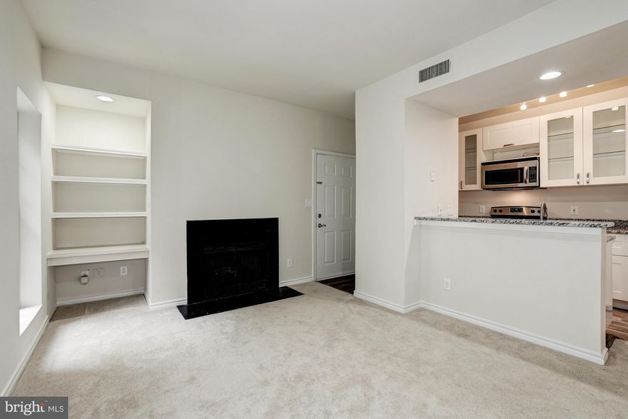 Welcome home! A MUST SEE - Enjoy your own private oasis with sweeping views of greenery! Beautifully updated kitchen with gorgeous finishes are to die for! LR w/Fireplace and filled with tons of natural sunlight. New floors, lighting, updated bath and so much more! Enjoy your reserved parking space, with plenty of visitor parking. Close to Metro, Fair Oaks Mall, Fairfax Corner and so much more!