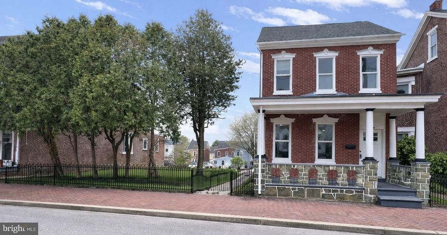 Welcome home to 26 E 5th Street.  This 5 bedroom, 1-1/2 bathroom completely renovated home is move-in ready.  A beautiful covered front porch greets you with impressive masonry work and an oversized grass side yard and back yard waiting for your future garden.  This is a double lot, property with almost a fifth of acreage!  The front half of the yard has freshly laid sod grass and new perennial plants lining the side of the home.  A slate walkway leads you from the street to the 2 side doors, and 1 rear door of the home and brings you out to the rear grassed backyard where there is an oversized double garage with access to the rear alley and many more perennial plants for you to enjoy.  All of the flooring throughout the home is brand new. The walls are all freshly painted in a neutral color to allow you to easily personalize the space to your unique style.  Modern lighting has been placed throughout the home, including recessed lighting throughout the first floor.  The first floor boasts high ceilings and lots of natural light.  The spacious new modern bright white kitchen has all brand new appliances with high quality quartz countertops, chrome hardware, and a tile backsplash.  There is a mudroom with laundry area and a 1/2 bathroom on the first floor, as well as a bonus room that could be used as a pantry or small office.  Head up the grand front staircase or the convenient rear staircase right off the kitchen to the second floor. There are 4 large bedrooms with closets, as well as a huge walk-in closet with built-in shelving and hooks. The large, bright bathroom has a tub shower and custom tile work.  Head up to the third floor where you will find a large 5th bedroom!  The large full walk-out basement leaves plenty of room for storage and convienent access to the backyard.  All appliances are included in the sale. There is a new electric hot water heater, a new natural gas boiler, a new roof on both the house and garage, and new electric service.  No detail was spared in this complete renovation - it is spectacular!  Book your tour of 26 E 5th Street today!