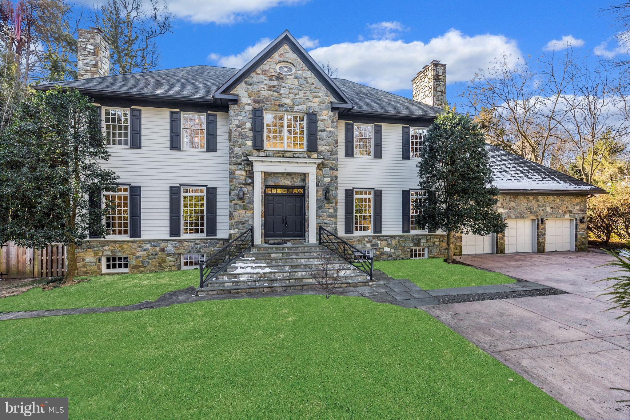 This classic stone colonial exudes New England style, complete with wood floors, lovely primary rooms, an expansive kitchen, 5 fireplaces and high ceilings. Sunlight pours into the home via multiple sets of French doors and skylights, allowing the outdoors to seamlessly blend into the interior spaces. The den, family room and kitchen all overlook mature gardens and lawn areas, a patio and a gorgeous black-bottom heated pool. There are 5 bedrooms, 5 full and one half baths, and over 5,400 square feet plus a fully finished lower level. Step into the spacious entry foyer, which is flanked by the formal living and dining rooms. Each of these rooms features a fireplace, and the dining room opens to a custom butler's pantry. There is a handsome home office/library, with built-ins and French doors opening to the rear yard. The family room is stunning, with a soaring 2-story ceiling, massive stone fireplace, dramatic windows and doors to the backyard. The kitchen is ideal for the entertainer, complete with long runs of granite counters, a huge island, and large table space. The main level is complete with the laundry room, a powder room and a full bath. Upstairs there are 4 spacious bedrooms, including a fabulous owner's suite. The owner's suite includes a sitting area enhanced by a fireplace, his-and-hers walk-in closets and a large bath. There are two bedrooms that share a jack-and-jill bath, and another bedroom with its own private full bath. The lower level offers brand new luxury carpeting, so much space for billiards, games, media and exercise, an ensuite guest bedroom and abundant storage space. Mature gardens add color year-round to the fully fenced backyard and a fabulous black-bottomed heated pool is ideal for entertaining or for the residents' own personal enjoyment. There is easy access to the main-level full bath from the pool, making it ideal for parties and warm weather fun. The home is located in the highly sought after Walt Whitman cluster, but has easy access to fine private schools as well. It is moments from downtown Bethesda, and has easy access to everything in and around the nation's capital. With its light-filled, inviting spaces, dramatic architectural appointments and fabulous outdoor amenities, this beautiful home is ideal for gracious living and entertaining indoors or out!