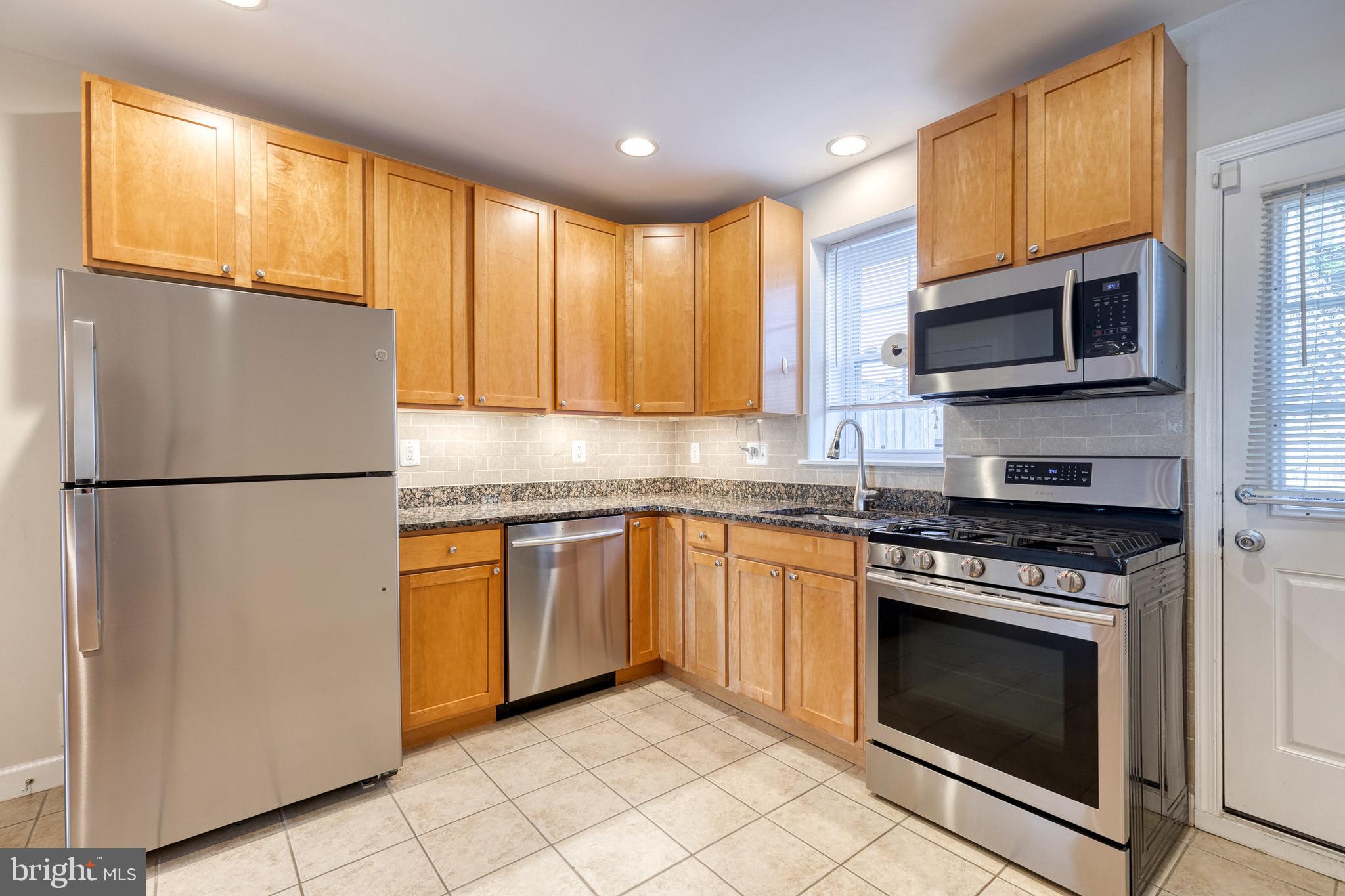 This completely renovated 2 Bedroom 2 Bath Row House in Hampden has everything you want! Spacious kitchen with stainless appliances, granite countertop and tile backsplash! Hardwood floors, exposed brick, large windows which let in lots of light! Spacious bedrooms, that are bright and airy. Both have ceiling fans and carpet. Two full baths that have updated hardware and granite vanity tops. Lots of storage space in the basement as well as full size washer and dryer. This house also has a great fenced in back yard where you can start your on garden! Close to The Avenue and Wyman Park. You don't want to miss this GEM in Hampden!
Monthly rent is priced as $2400/month' first month's rent and one month security deposit needed to move in ($4800). Utilities are not included in the price. Verifiable income of at least 3x monthly rent and 650 minimum credit score is necessary to qualify. Pets are allowed and will be considered on a case to case basis.