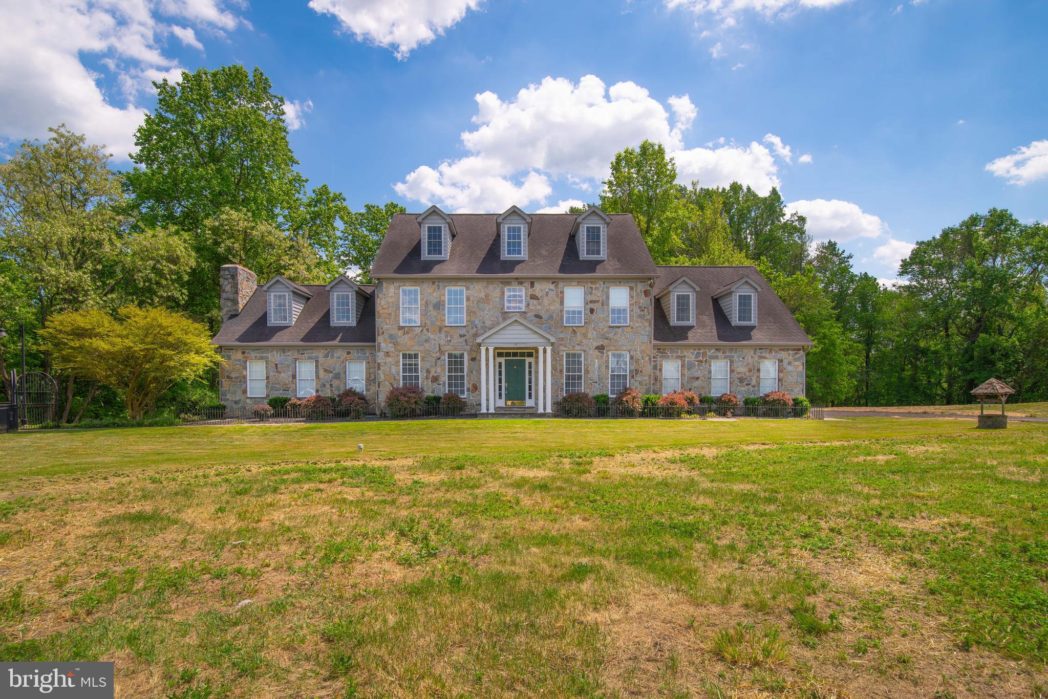 Fell through due to financing. An exceptional find, this custom-built home graces the market for the first time, showcasing a wealth of unique features and thoughtful design touches. Step into the stunning kitchen, adorned with custom-built cabinets, a chef's delight gas stove, double oven, and exquisite granite countertops. The heart of the home is the impressive two-story family room, boasting a floor-to-ceiling stack stone fireplace—a true centerpiece for gatherings and relaxation. On the main level, discover the primary bedroom retreat complete with a full bath and a walk-in closet featuring built-in storage. The lower level presents a fully equipped kitchen, two bedrooms, a full bath, a spacious great room, and even your own washer & dryer. Sliders lead to a private patio, offering the perfect setup for in-law accommodations. Level 1 encompasses four bedrooms and two full baths, while Level 2 features a recreation room with another full bath. Ample parking is provided by a four-car garage, with an additional full bath conveniently located off the garage. Nestled in a serene and private location, yet with quick access to Rt.2 and major roads, this home offers the perfect balance of tranquility and convenience. Enjoy an easy 45-minute commute to D.C. or Baltimore, and just 20 minutes to Annapolis—a prime location for modern living at its finest.