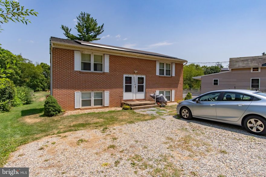 OPPORTUNITY KNOCKS-ALL BRICK DUPLEX in prime Hagerstown location! Outside of city limits, close to HCC, Robinwood & Meritus + in Smithsburg school district. Perfect for investor looking for 2 turn key rentals or live in one side & offset your mortgage with rent from the other!! Over/under units are identical layouts and feature spacious living room, kitchen, dining area & 2 BDRM/1 BA + laundry. Off street parking just in front of the house for at least 4 vehicles. HUGE .68 acre lot runs to tree line in the rear. Replacement windows, roof replaced in 2016, heat pumps, CAC, electric HWH, public water & septic. Separately metered electric. Leased solar panels thru Tesla (check out the energy savings!!). Unit A is owner occupied. Unit B is under lease until 02/28/2025 at $850/mo. Unit B has lead free certificate. Neighbor to the left has legal right of way over driveway for access to their property.