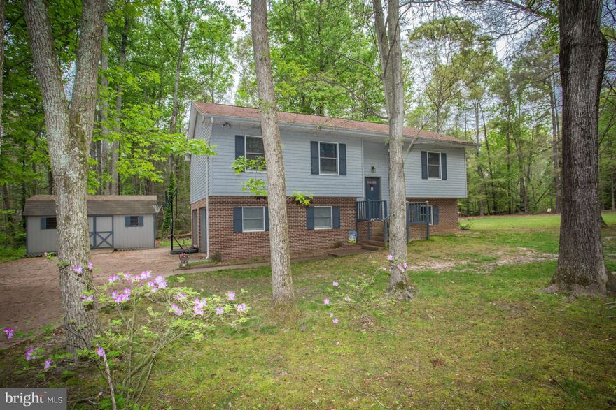 PRICE REDUCTION!!  Cute split foyer on a beautiful wooded corner lot.  Home has 3 bedrooms, 3 full baths and 2 car garage. Lower level has family room with wood stove.  There is a nice paved driveway leading up to large shed.  SEE VIDEO TOUR  Don't miss this one!