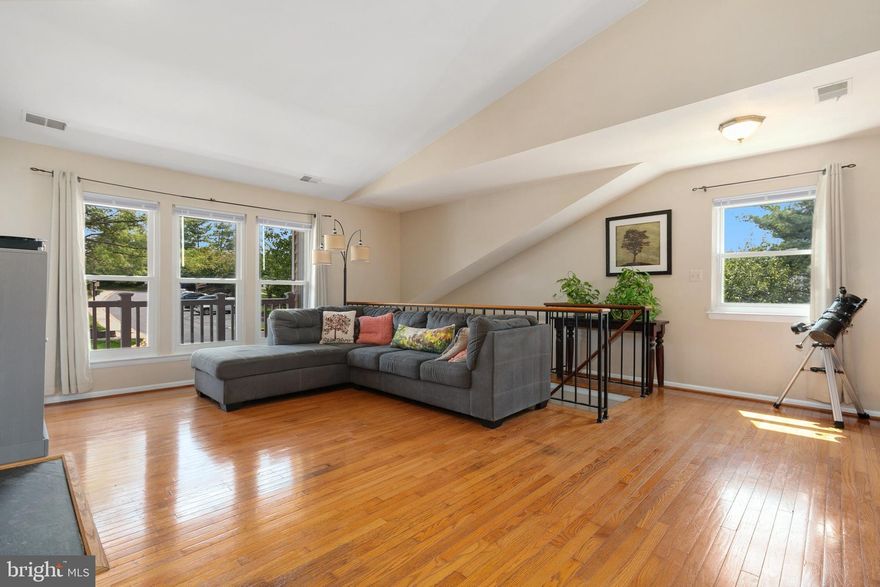 This light & bright 2-bedroom home is ready for you!  You'll love all the light that comes in since this is an end-unit and the vaulted ceilings give it an airy feeling.  Wood floors give it a homey feel. The layout is flexible, with dining space in the kitchen, giving you options on how to use the dining area.  This home is centrally located and in a quiet community. Get ready to see it soon because it will not last!