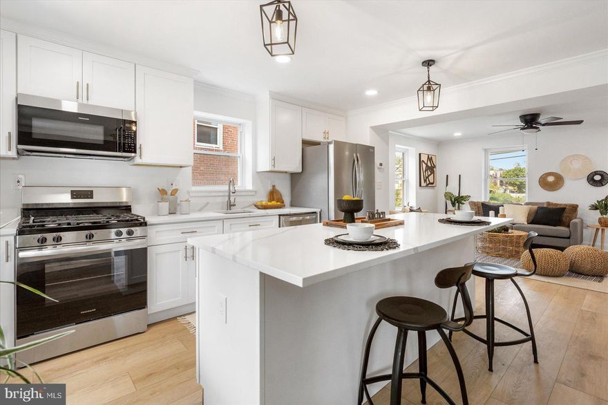 Newly remodeled 3BR/2BA oversized end of row Townhome located in the quiet neighborhood of Arlington.  Walk up to the large covered front porch with a beadboard ceiling, and open the door into your forever home.  A beautiful transformation has taken place throughout the open concept main floor boasting tons of natural light, recessed lighting, and stunning luxury flooring.  The open floor plan features a large living room, spacious dining room with a stunning custom feature wall, and a glamorous kitchen. The kitchen features plenty of cabinets to the ceiling, stainless steel appliances, sleek quartz countertops, a deep stainless sink under a window, and an 8FT island with pendant lighting and breakfast seating.  On the second floor is a large primary bedroom, two sizable secondary bedrooms, and a newly remodeled full bath. The lower level offers additional finished living space offering a spacious family room, full bath with walk-in shower, laundry, storage, and a walk-out to the fenced yard.  From the main floor step outside to a covered deck with access to the green space below offering tons of possibilities.  This home has been completely transformed and is ideal for any new homeowner.  Imagine all this and in close proximity to shopping, restaurants, and commuter routes.