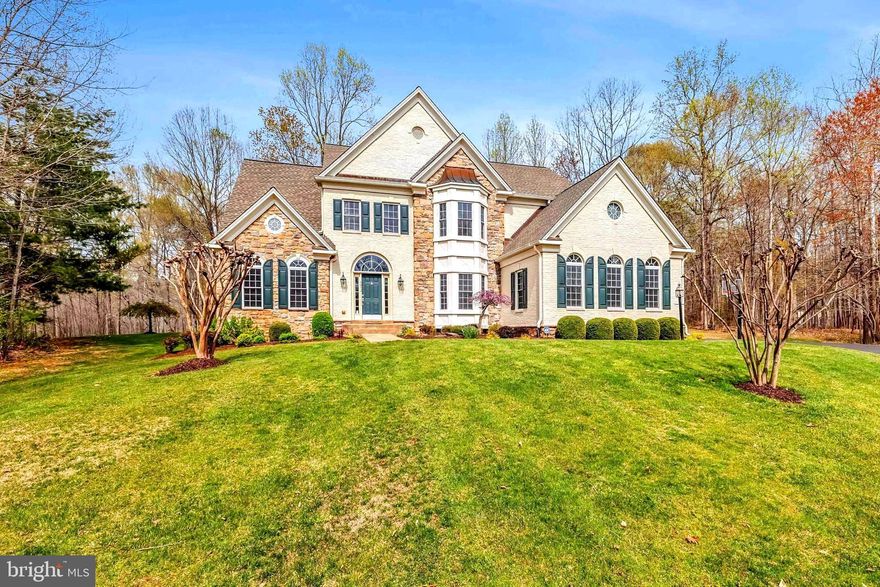 Perfectly located in the BEAUTIFUL Community of Reserve at Hunter’s Ridge, this GORGEOUS Home Truly has it All * From the STATELY Exterior to the SERENE Wooded Setting, to the FANTASTIC Layout & the 3-Car Side-load Garage * NEARLY 3 Acres of MATURE Trees creates a PRIVATE Oasis perched above the street below offering LOVELY views of Nature * With OVER 6,200 Finished Square Feet of Casual Elegance & EXCELLENT Flow for Entertaining, you’ll NEVER want to leave * The Original Owners have LOVED this Home & it shows with its PRISTINE Condition & Loads of UPGRADES Throughout * Whole House Audio System with Built-in Speakers, EXTENSIVE Trim & Moldings, Hard-wired Security System with Motion Detectors, EXTRA Recessed Lighting & MORE * The GRAND Entry Foyer boasts a DRAMATIC Split Staircase & opens to SPACIOUS Formal Rooms & a Main Level Study * The HUGE Eat-in Kitchen offers a LARGE Island, AMPLE Work/Storage Space, Walk-in Pantry & SUNNY Breakfast Area * The adjacent LIGHT-FILLED Family Room boasts a 2-Sided Gas Fireplace to the PRETTY Sunroom * The ENORMOUS Owner’s Suite has a DEEP Tray Ceiling, DUAL Walk-in Closets & LUXURIOUS Bath * Secondary Bedrooms are SPACIOUS & include 2 Suites with Private Baths as well as 2 that share a Jack-n-Jill Bath * The Walk-up Lower Level is GREAT for Entertaining featuring OPEN VERSATILE Spaces, a COZY Gas Fireplace & a GIGANTIC Den/Exercise Room with a Walk-in Closet & direct access to a Full Bath * BIG Laundry Room & AMPLE Storage Space with Shelving Units Galore finish off the Basement * Enjoy Outdoor Dining & Relaxing on the MASSIVE Paver Patio just steps down from the Main Level Trex Deck * Level Rear Yard provides Room to Run & Play and is surrounded by PRIVACY Trees * In-ground Irrigation System makes Lawn Maintenance a Breeze * The Permanent Basketball Hoop provides hours of Fun & Games * NEWER Roof (2017), NEWER HVAC System (2019), NEW Water Heater & NEW Water Pressure Tank (2024) & More * Just minutes to County Government Center, Baseball Stadium, Restaurants & Shopping