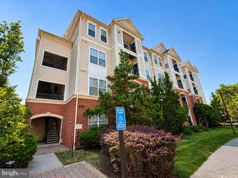Photo of 11350 Aristotle Drive #7-103, FAIRFAX, VA 22030 (MLS # VAFX2334460)