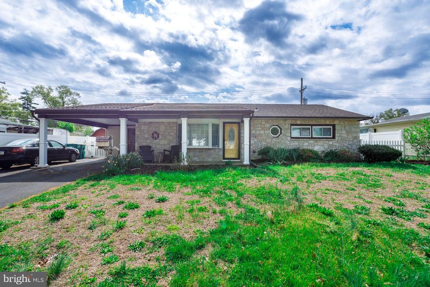 Situated on a large, level lot in the Thornridge community, this 3-bedroom, 1-bath ranch offers a functional single-level layout and a beautifully updated main living area. The exterior boasts a unique, authentic stone front imported from Italy, adding a sophisticated touch to the home’s curb appeal, alongside an inviting covered front porch and a covered carport. Upon entry, the home reveals a bright, open-concept living and dining space highlighted by low-maintenance flooring and a neutral gray color scheme. The updated kitchen is a standout feature, centered around a charming bay window, white cabinetry, and newer stainless steel appliances - including a stylish stainless apron sink. Recessed lighting and a modern grey subway tile backsplash complete this bright and polished space. Down the hall, you will find three bedrooms and a full bathroom. For peace of mind and efficiency, the home features a new central air system and heat pump. Outside, the expansive and level fenced backyard features a concrete patio and a storage shed, providing a versatile space for outdoor gathering. Appreciate the local convenience of being just minutes from the Oxford Valley shopping corridor and several beautiful community parks. This location offers easy access to I-95, the PA Turnpike, and nearby SEPTA regional rail stations for a seamless commute to Philadelphia or throughout the region. All of this comes alongside the highly-rated Pennsbury School District.