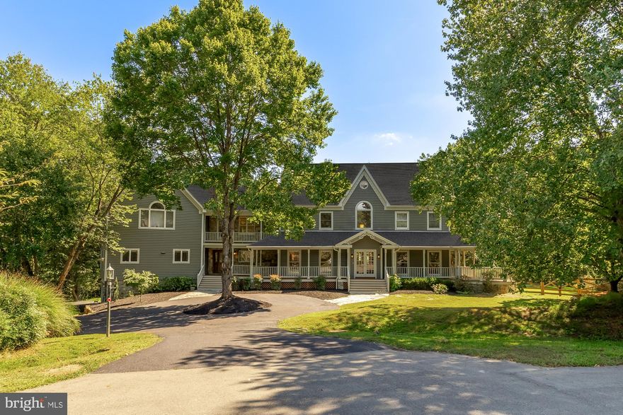 Welcome to this extraordinary 7,700+ square foot custom estate, designed to be as timeless as it is functional. Built by a craftsman for his own family, every detail speaks to quality—thoughtful layouts, hand-selected finishes, and a sense of enduring elegance.

Set at the end of a cherry-blossom-lined cul-de-sac in a coveted community near North Potomac, the residence offers privacy, natural beauty, and a refined backdrop for everyday living and entertaining.

Inside, the home balances grandeur and warmth with six spacious bedrooms and five and a half baths. The main level includes a full in-law suite complete with its own kitchen, living room, and spa-inspired bath—ideal for multi-generational living or long-term guests. The chef’s kitchen anchors the main level, outfitted with quartz counters, custom cabinetry, and premium appliances, opening seamlessly into light-filled living and dining spaces. Two handcrafted staircases lead upstairs to four ensuite bedrooms, while the finished attic adds flexible living space and two bonus storage rooms.

The walk-out lower level expands the home’s versatility, featuring a full gym, home theater area, bath, and abundant storage. Thoughtful touches like dual gas fireplaces, crown molding, and oversized windows create a sense of warmth and sophistication throughout.

Outdoors, the setting is just as remarkable. A welcoming circular driveway leads to a stately front porch and oversized two-car garage equipped with dual EV chargers, with additional driveway space ensuring plenty of guest parking. A front gazebo invites morning coffee, while a wrap-around porch and tiered deck with dual seating areas provide the perfect backdrop for gatherings. The 1.5-acre lot is fully fenced and professionally landscaped, backing to a tranquil creek surrounded by mature trees.

This home is minutes from top-rated Montgomery County schools, parks, and commuter routes, making it an ideal retreat that remains well connected to the surrounding North Potomac and Montgomery County community.

A rare combination of craftsmanship, space, and serenity—this estate is more than a house; it’s the place where your story begins.