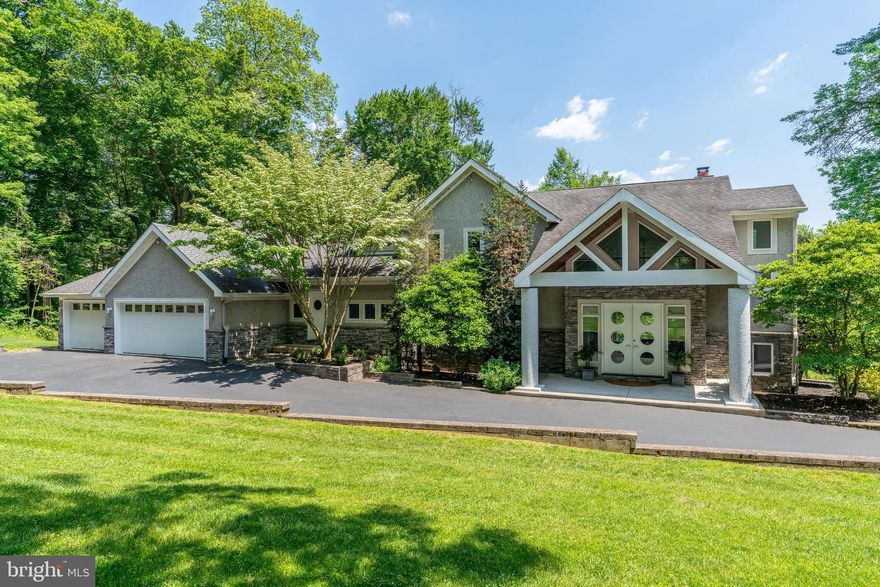 Where style and serenity meet, 2 Forrest Lane is a suburban secluded home/retreat featuring contemporary California style open plan living just 30 minutes from Philadelphia.  The 6500+ SF,  4 bedroom home, (floor plans provided), with main floor primary  bedroom, is located on a 3.6+ acre private wooded lot with stunning water views.  *** House and all finishes were designed with quality and ease of maintenance in mind.  Full details of the home can be found in the virtual tour of this listing.  This home includes so many high-end amenities that it is impossible to detail them all in these remarks. ***   Main floor features:  wall of windows with motorized solar shades, Slate tile flooring, 20’ vaulted ceilings, maple flooring, and a floor to ceiling brick fireplace to add architectural interest. The gourmet kitchen features: high-end GE Monogram appliances, Thermador cooktop, granite countertops with seating, granite island with café sink, cabinets are glass front solid cherry wood. A separate, expansive pantry houses a 2nd refrigerator and provides additional storage and adjoining Dining Room seats up to 12 ppl.  400 SF main-floor primary bedroom features:   illuminated tray ceiling, 2 walk-in closets, bathroom with double granite vanities, cabinet storage, a private toilet room with bidet, enclosed spa room, 400-gallon sunken hot tub.  Spacious deck runs the entire length of the first floor with spectacular views.  Also on this level is laundry room facility, mud room and entrance to a three car attached garage.  Upstairs features: two additional bedrooms with walk-in closets and a shared full bathroom. Basement features: walk-out level, 10’–12’ ceilings, double doors, carpeted workout and TV area, and professional home office, a third bathroom with shower.  Unfinished section features:  Versatile 1200 SF  which can be made into a fourth bedroom (as shown in the floor plan), in-law suite, theatre, indoor pool or anything you might like to create.  Additional Home Features. New roof and oversized gutters, Newer 2-Zone Trane Heating/Air-conditioning System – Propane with privately owned 1000 gallon in-ground storage tank. On-site well water with oversized storage tank, water softener and neutralizer. The kitchen provides an under-sink reverse osmosis water filtration system for drinking. Dedicated 400A electrical service and enclosed utility closet in basement area with fully networked and wired cable, CAT5e ethernet and PBX phone system. 2+1 (3 car) garages. Internet enabled features include automated lighting, thermostats and garage monitoring. Main floor fully wired with in-ceiling stereo speakers, including master bathroom and spa/hot tub room. Ideally located near Marple shopping areas and Media Borough with community events like holiday parades or the annual 5 mile run, local theater, and plethora of restaurants to host outdoor dining events in warm weather. Also ideal for any commuter by being convenient to I-476 and rt 1 for connection to all major roads, 30 minutes to Center City Philadelphia, or King of Prussia and 10 minutes from Philadelphia Airport.