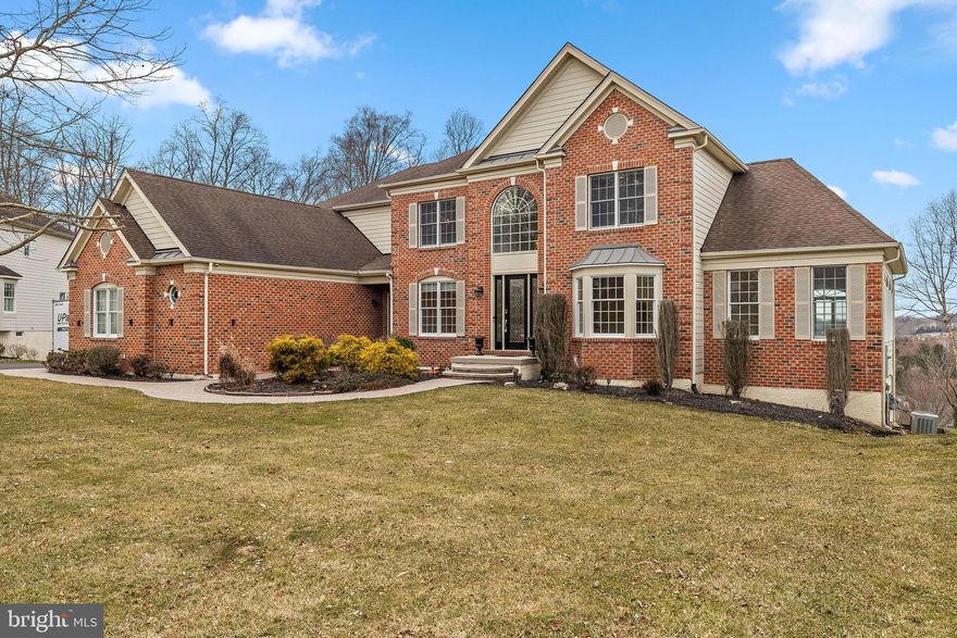 Welcome to the expanded Chelsea model at 17 L'enfant Court in desirable Tall Trees at Thornbury.   A circular walkway finished with custom paver stones & lavish landscaping  awaits you as you enter the main doorway into your grandiose two story foyer complete with a turned staircase and upgraded wrought iron spindles. The main level is finished with hard wood flooring through out.  3-piece crown molding & wainscoting can be found in the foyer, living and dining areas.  An office/den/bonus room along with two light filled solariums can also be found on this floor. The gourmet kitchen offers GE low profile stainless steel appliances that includes a double wall oven & an oversized center island w/ built in gas range, granite countertops, custom cabinets & neutral stone tile back splash. French doors in the solarium lead to a beautiful oversized trex deck that showcases the rolling hills, trees and gorgeous views of the neighborhood complete with a sunset. Other features that can be found on the main floor include gas fireplace located in the great room, a paradigm surround sound speaker system, laundry room and a 2nd staircase in the kitchen that leads to the upper level. A tray ceiling welcomes you into the primary suite along with double walk-in closets, a sitting/dressing area and an en-suite bathroom featuring pocket doors, a soaking tub, dual shower head shower stall and two sink vanities. The upper level also consists of 3 additional spacious bedrooms...one bedroom has its very own en-suite bath and the other bedrooms shares a Jack and Jill style bath. An additional 2000 sq ft can be found in the fully finished walkout basement/lower level equipped with a 5th bed, full bath and a sound proof room perfect for music (this room can also be used as a 6th bedroom). Tons of storage and extra living space can also be found on  this level. Features worth mentioning: upgraded "fine art" lighting, oversized entryway door with beveled glass, new windows throughout, new exterior hardy plank siding, 3 zoned HVAC, two 200 AMP breaker panels, custom cordless window shades, a freshly sealed oversized driveway, low taxes, West Chester School district and a 3 car garage featuring 8x8 garage doors. This home is a MUST SEE..situated on a premium lot in a cul-de-sac location with community walking trails. This is luxury living at its finest. *Professional Photos & video will be available Tuesday 2/27.