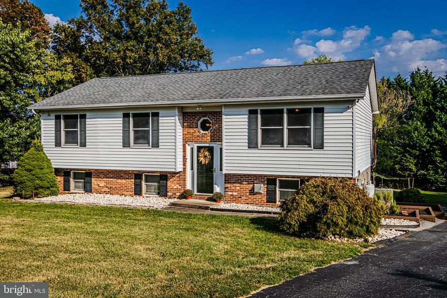 Looking for some privacy? Situated on a quiet cul de sac, this lovely bi-level home sits on a beautiful .91 acre lot with mature trees. (Savor the fruit from your own fruit trees.) Enjoy the living options created by a bi-level floor plan. Fresh paint brightens the main level which includes a large eat-in kitchen with stainless steel appliances and sliders to the large deck for outdoor living. A spacious living room and a primary bedroom with attached full bath, two additional bedrooms and another full bath complete the main level. The lower level includes the laundry, a half bath and a very large family room with sliders to the patio. 
Cool off in the above ground pool with deck. Other details include an attached 2 car heated garage, rear loading garage with direct access to the basement. The HVAC and water heated both were installed in 2018. The 30 year architectural shingle roof was installed in 2015. There is a security camera and water filter system. 
In the rear of the property are a chicken coop and 6 chickens. If the buyer would like them (think fresh eggs) the seller will leave them.  If not the sellers will remove all.