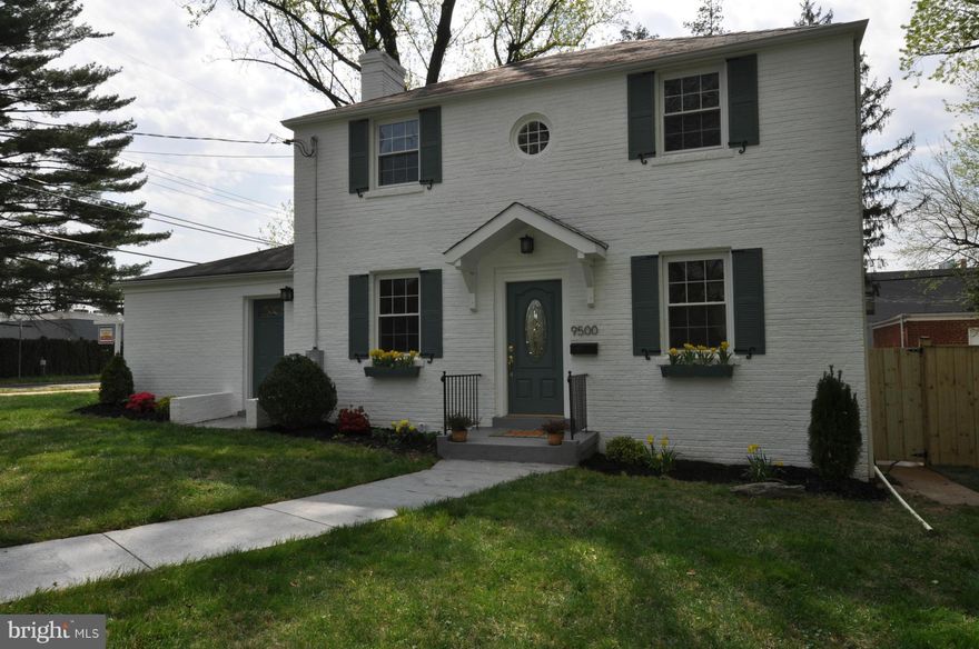 Spacious brick colonial on corner lot.4 bedrms w/4 full bathrms. Large fenced in front & rear yards for family fun Includes a dog run. Renov & updates w/hardwd flrs-recess lights thru-out.Open kitchen-dining rm.Wood Burning FP,in-law suite-office on main level w/separate entrance & bathrm. Finished basement-family rm w/bathrm. Detached 2 car garage w/remote. Quiet neighborhood.Walk to metro-bus.