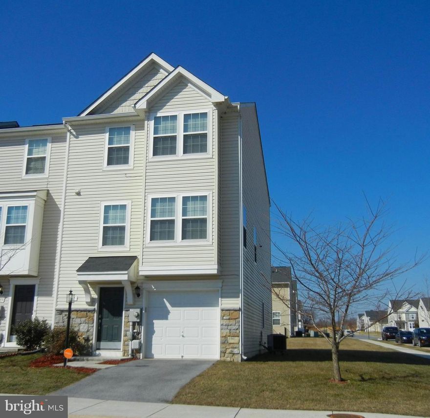 Large end unit garage townhouse in Fairfax Crossing offers three finished levels!  Features include kitchen with island  and large eating area, which opens to family room with sliding door to composite deck.  Large master suite  features tray ceiling with fan, walk-in closet and master bathroom  with separate tub and shower and double vanities. Bedrooms 2 and 3 have vaulted ceilings. Bedroom 4 is located in the lower level which also includes a closet and  walk-out door. There is also a  full bath, recreation or hobby room, and laundry.  Plus, the garage is located on the outside wall of the unit, so there is  plenty of room to navigate  the driveway and to open  car doors in front yard without encroaching on neighbors.   There are also plenty of  parking spaces across the street.  Community offers wide sidewalks, street lights, and a tot lot. Conveniently located off of commuting route 9 and near stores and eateries .