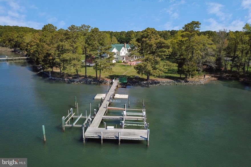 Located on the Tred Avon River in Hopkins Neck this offering is only 15 minutes to St. Michaels or Easton, minutes by boat to Oxford, and offers the best of Eastern Shore living. Sited on 3.39 acres with over 350+/- feet of waterfrontage, this beautiful home offers 7,000+/- square foot of living space on 3 levels. The main floor offers a 2-story foyer, office, gourmet kitchen, dining area, living room with wood-burning fireplace, generous-sized family room, and a master bedroom with a large bathroom and walk-in closet. The gourmet chef's kitchen offers stainless steel appliances, professional grade Wolf range with 6-burners & griddle, Sub-zero fridge & freezer, 2 dishwashers, warming drawer, island, granite counters, a pantry with ice-maker, and small & large wine fridges. The main level is completed by a full bathroom & laundry room. The second level features 6 additional bedrooms, each with en-suite bathrooms, a morning bar area, and an additional laundry closet. One of the bedrooms features a spiral staircase to a crow s nest-style office overlooking the wonderful property and waterfront. The 3rd level is a large loft area perfect for more bunks or recreation, a full bath, and attic space perfect for storage. A large 3-car garage with workshop room completes the residence.  6' MLW .   Septic is < # BR.  Check out our Virtual Tour and 3D walk through!
