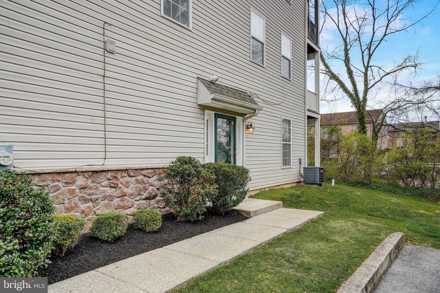 This rare corner unit with plenty of windows and fresh paint throughout is ready for new memories to be made. Enter from the side entrance allowing for more privacy and into the foyer where you have access to your one-car garage, which is ready for 240V EV charging. On this level is also a huge bedroom with an ensuite and sliding doors leading out to the ground level patio backing up to woods. You'll find that the main living level has an open concept floor plan with a large living room with sliders out to the covered balcony overlooking the woods. The living room opens to the dining area and kitchen. The updated kitchen has a large center island with seating, a tile backsplash, stainless steel appliances and gas cooking. The primary bedroom on this level has vinyl plank flooring with a walk-in closet and ensuite bath complete with a dual vanity and walk-in shower. The second bedroom is on this level also has vinyl plank flooring and it is serviced by the hall full bathroom. The laundry room has been renovated with a new smart-connected stacked laundry system, new light fixture and tile flooring. This home is also updated with a smart thermostat. Located in a prime location, the bus system is located right at the HOA entrance and is in close proximity to the Lansdowne Septa Regional Rail Station and Yeadon Community Park.