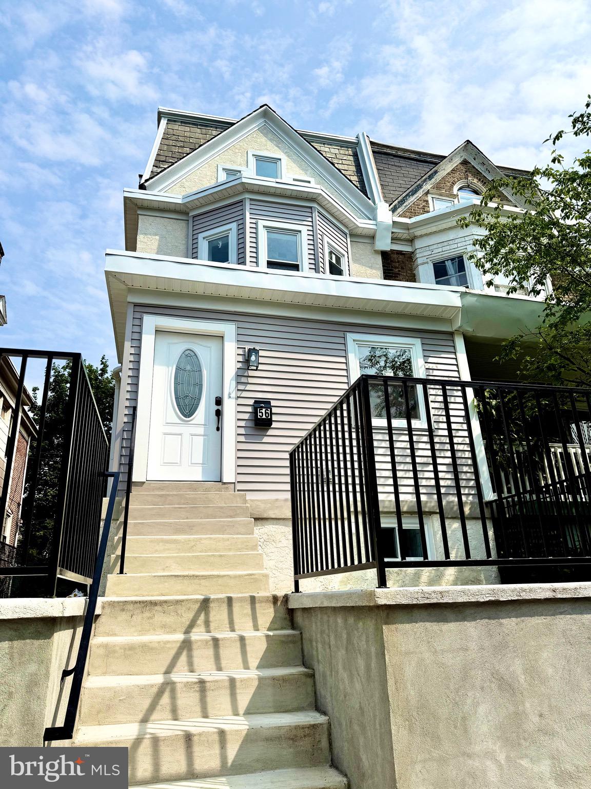 Beautifully renovated 6 bedroom/4 bathroom Twin-Home in Historical Germantown! House sits on a large lot with a front and private back yard. Upon ascending the front staircase, you are welcomed onto the front porch, a peaceful spot to relax. Enter into a foyer and a spacious first floor featuring a half bath and laundry rooms, living room, a dining room area , tall ceilings with crown moldings beautiful hardwood flooring, a chefs kitchen with backsplash, quartz counters and newer appliances as well as an entrance to the large back yard, which is a great space to entertain and unwind. The second floor features three generously sized bedrooms and 2 fully renovated bathrooms, the master en-suite is beautifully done as well. All bedrooms have ample closet/storage space. The third floor has 2 oversized bedrooms. The finished cozy basement is perfect for a family room, gym, or an office, and provides limitless possibilities the 6th bedroom is on this floor and has its own kitchenette and egress to go out to the backyard as well as a full bathroom. Some of the upgrades include: new HVAC and high efficiency heater (2025), new bathrooms (2025), appliances (2025), electric upgrade (2025) too many to name here. Contact listing agent for complete list of upgrades. Sale includes security system. Situated in Germantown near historical landmarks, many parks including Wissahickon Park with over 1800 acres of hiking and biking trails, waterways, picnic and sporting areas, ideally located near coffee shops, Weaver Way Coop locations and dining. Walk down tree lined streets for local ice cream, hard cider, or farm to table fare. Nearby neighborhoods like W Mt. Airy, Chestnut Hill, Roxborough/Manayunk and East Falls provide easy access to even more restaurants, shopping and entertainment. Commuting is a breeze with the home's close proximity to Lincoln Drive, providing a quick ride to major highways and just a brisk walk to many nearby public transportation options.
