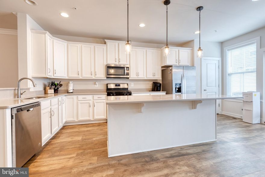 Just 4-years young, this gorgeous 3-level townhome in Odenton Station boasts 3 bedrooms, 2.5 bathrooms, 2-car garage, and 2000 SQFT of living space! Entry level with bonus room perfect for a home office, family room, or possible 4th bedroom. Main upper level has a beautiful eat-in gourmet kitchen, ample cabinet and counter space, stainless steel appliances, and access to upper level balcony. Proximity to local conveniences and Ft. Meade. Just a stones throw from the local MARC station making for easy commute to Baltimore, BWI Airport, and Washington, D.C.!