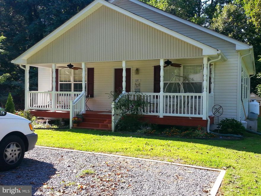 Adorable 3 bedroom, 2 bath cottage with a spacious floor plan.  Large open Living room with breakfast bar, great window lighting and relaxing country porch.   This is in the Town of Colonial Beach, water access and 2 blocks from the river. This home is in Great condition! Located in The Town Of Colonial Beach, which is a Beach  & Golf Cart Community close to The Main Beach!