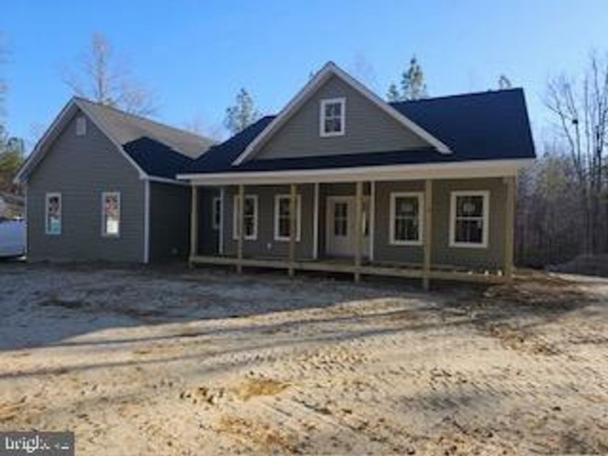 Brand New and Available for March Delivery! Nestled on a generous 2-acre lot, this exquisite ranch-style residence is a canvas awaiting your personal touch. With construction set to be completed in 2026, this home offers a unique opportunity to customize your living space while enjoying the luxury of modern design and high-end features. As you approach the property, the charming exterior, adorned with durable vinyl siding, invites you into a world of comfort and elegance. The side-entry garage, complete with a garage door opener, provides both convenience and a polished aesthetic. The expansive lot backs to lush trees, creating a serene backdrop that enhances your privacy and connection to nature. Step inside to discover a thoughtfully designed layout that maximizes space and functionality. The heart of the home features a spacious kitchen equipped with stainless steel appliances, including a sleek oven/range and a dishwasher, perfect for culinary enthusiasts. The open-concept design flows seamlessly into the living areas, where natural light pours in through energy-efficient double-pane windows, ensuring a warm and inviting atmosphere. With three well-appointed bedrooms and two full bathrooms, this home is designed for comfort and relaxation. The main floor laundry adds an element of convenience, making daily chores a breeze. The unfinished basement offers endless possibilities, whether you envision a cozy family room, additional bedrooms, or a personal gym. With rough plumbing already in place, the potential for customization is limitless. Luxury extends beyond the interior, as the property boasts a tranquil porch, ideal for morning coffee or evening gatherings. The surrounding wooded area not only enhances the beauty of the landscape but also provides a peaceful retreat from the hustle and bustle of everyday life. This home is not just a residence; it's a lifestyle. Embrace the exclusivity of living in a space that combines modern amenities with the tranquility of nature. With no association fees or community restrictions, you have the freedom to create your own oasis. Don't miss the chance to make this exceptional property your own, where luxury meets comfort in a setting that feels like home.