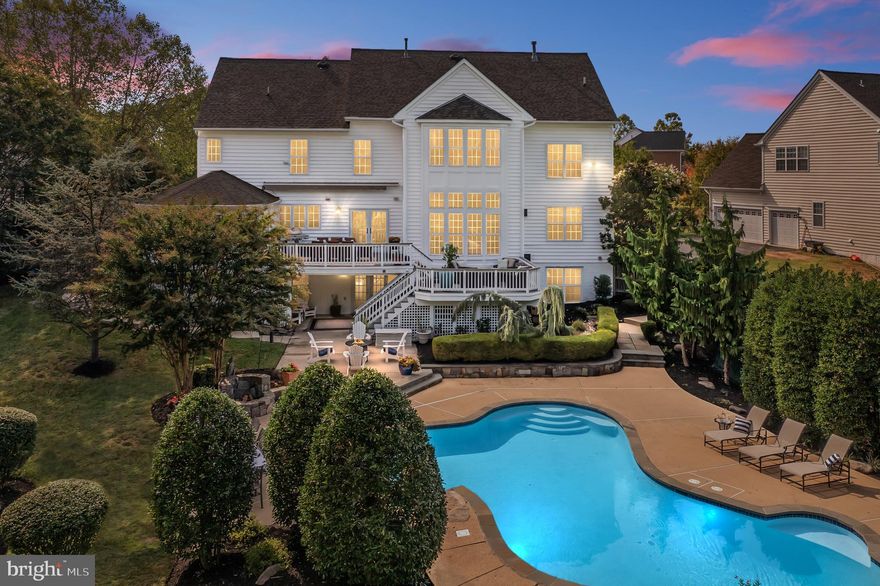 Step into the remarkable world of Ashleigh Knolls, where opulence, sophistication, and comfort unite to offer you the ultimate living experience. This exceptional property, custom built by Mitchell and Best, presents a unique opportunity, boasting 6 bedrooms, 4 full baths, and 2 half baths, all meticulously designed to cater to your every desire.  As you step through the door, you'll be greeted by an ambiance of refined beauty that invites you to create countless unforgettable memories. The cozy gas fireplace sets the stage for intimate gatherings or grand celebrations, and the multiple gathering rooms provide the versatility to suit any occasion.  The heart of this residence is the dreamy gourmet kitchen, a haven for culinary enthusiasts.  Custom cabinetry, top-tier appliances, and exquisite counters grace the space, while the spacious island becomes a hub for social interaction. Transition seamlessly from the kitchen to the gracious dining room and the expansive living room, ensuring a smooth flow for all your entertainment needs.  For those who cherish the outdoors, the sunlit breakfast nook opens onto a spacious deck, where you can savor your morning coffee or indulge in al fresco dining. The light-filled family room exudes warmth and character, featuring architectural details and a crackling gas fireplace. 
 Ascending the grand staircase in the impressive 2-story foyer, you'll discover a second level exuding pure luxury. Five charming bedrooms await, including the primary ensuite bedroom, complete with a spa-inspired bath that has been tastefully updated. Four additional guest suites are thoughtfully arranged in pairs, sharing jack and jill baths for both comfort and convenience.  The lower level of this exceptional home offers endless possibilities for relaxation and recreation. A sprawling recreation room, den, exercise room, full bath, and bedroom are flooded with natural light, creating a welcoming space for leisure and entertainment.  Outside, mature landscaping envelops the property, creating a serene and picturesque backdrop. The fenced rear yard unveils a private oasis, ensuring tranquility and exclusivity. Immerse yourself in your personal paradise, where an inviting swimming pool glistens under the sun's embrace, offering moments of relaxation, exercise, and family fun. The poolside view from the house keeps you connected to this soothing oasis.  Multiple patio areas are thoughtfully designed to cater to all your desires. A spacious main patio, perfect for outdoor dining, lets you host memorable gatherings and share delectable meals under the open sky. Adjacent, a lounge patio provides a relaxing retreat for you and your guests, offering plush seating for conversations, cocktails, and cherished moments.  Elevate your outdoor experience with spacious decking areas that add versatility and character to your property. From sun-soaked morning coffees to evening gatherings around a fire pit, these decking spaces offer the freedom to tailor your outdoor environment to your heart's content.  With an oversized garage and a spacious driveway, this is a rare opportunity that you won't want to miss. Make this extraordinary house your home, and immerse yourself in luxury, elegance, and a lifestyle that is truly unmatched. Welcome home to Ashleigh Knolls, where your dreams become a reality.