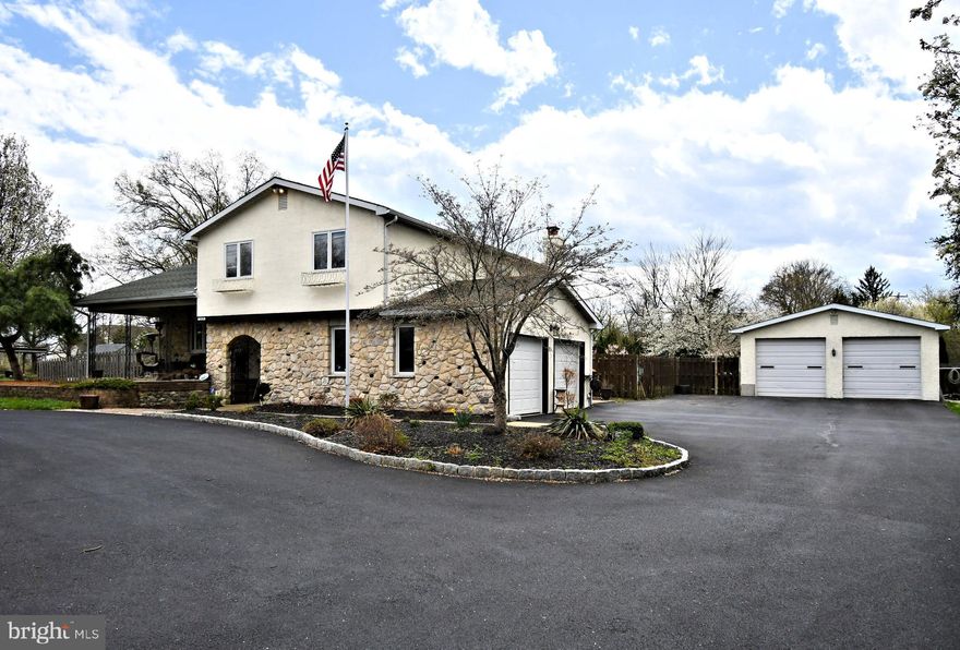 Great opportunity for small contractor or landscaper or growing family.  Four bedroom 2 full bath 2 powder room split level single home with 2 car attached and oversized 2 car detached garages with circular driveway on a 1 acre lot.  Four level home.  Main level with large living room and dining room with hardwood floors and crown molding and chair rails.  Eat in kitchen with gas cooking and double oven.   Family room with 15 x 20 addition.   Finished basement level with powder room and utility room.   Master bedroom with remodeled ceramic tile master bath with oversized shower and double vanity.  Three generously sized spare bedrooms.  Private park like fenced in back yard.